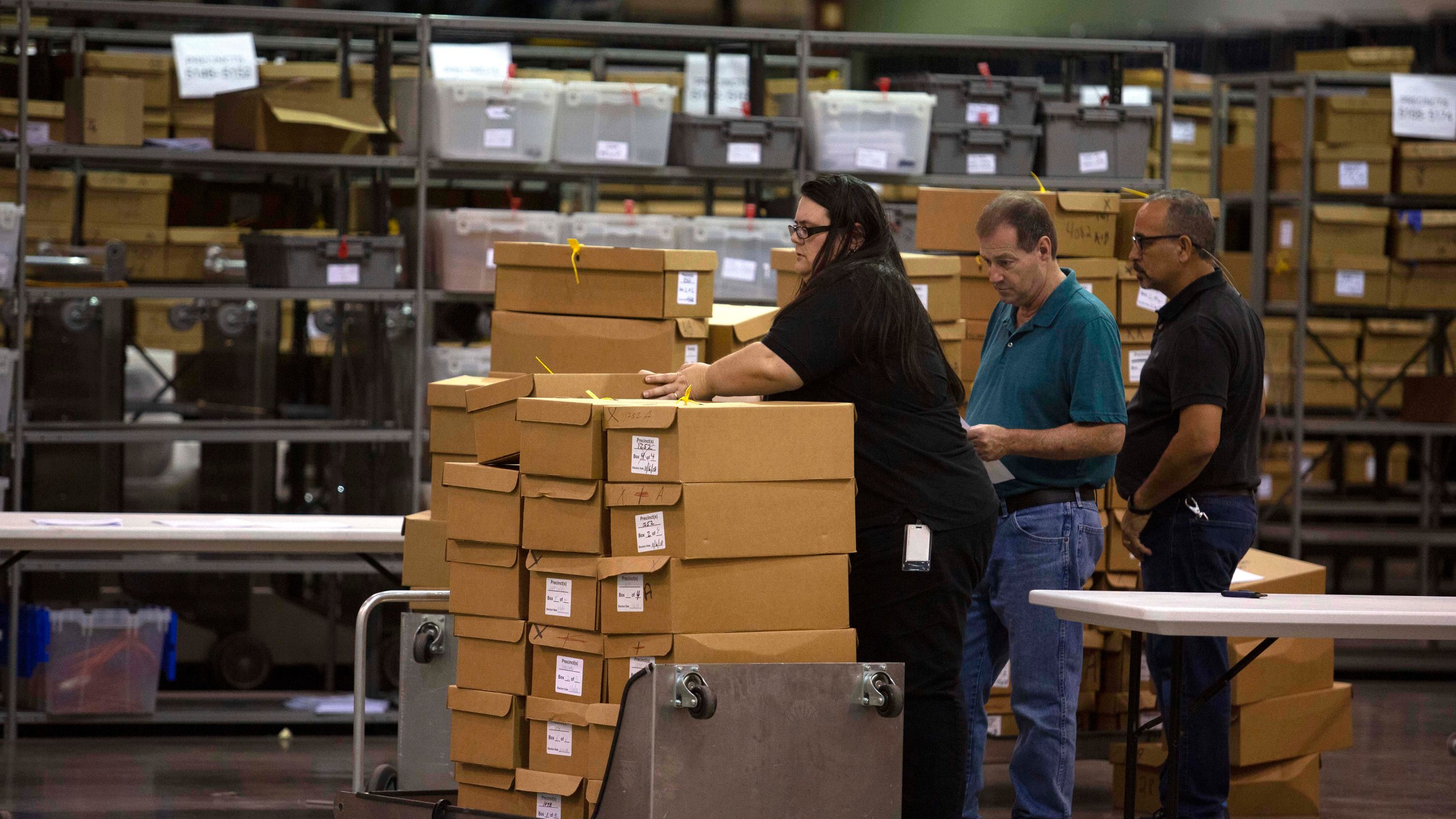 Boxes of ballots are moved by workers at the Supervisor of Elections Service Center on Nov. 15, 2018 in Palm Beach, Florida. (Credit: Saul Martinez/Getty Images)