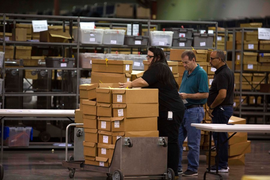 Boxes of ballots are moved by workers at the Supervisor of Elections Service Center on Nov. 15, 2018 in Palm Beach, Florida. (Credit: Saul Martinez/Getty Images)