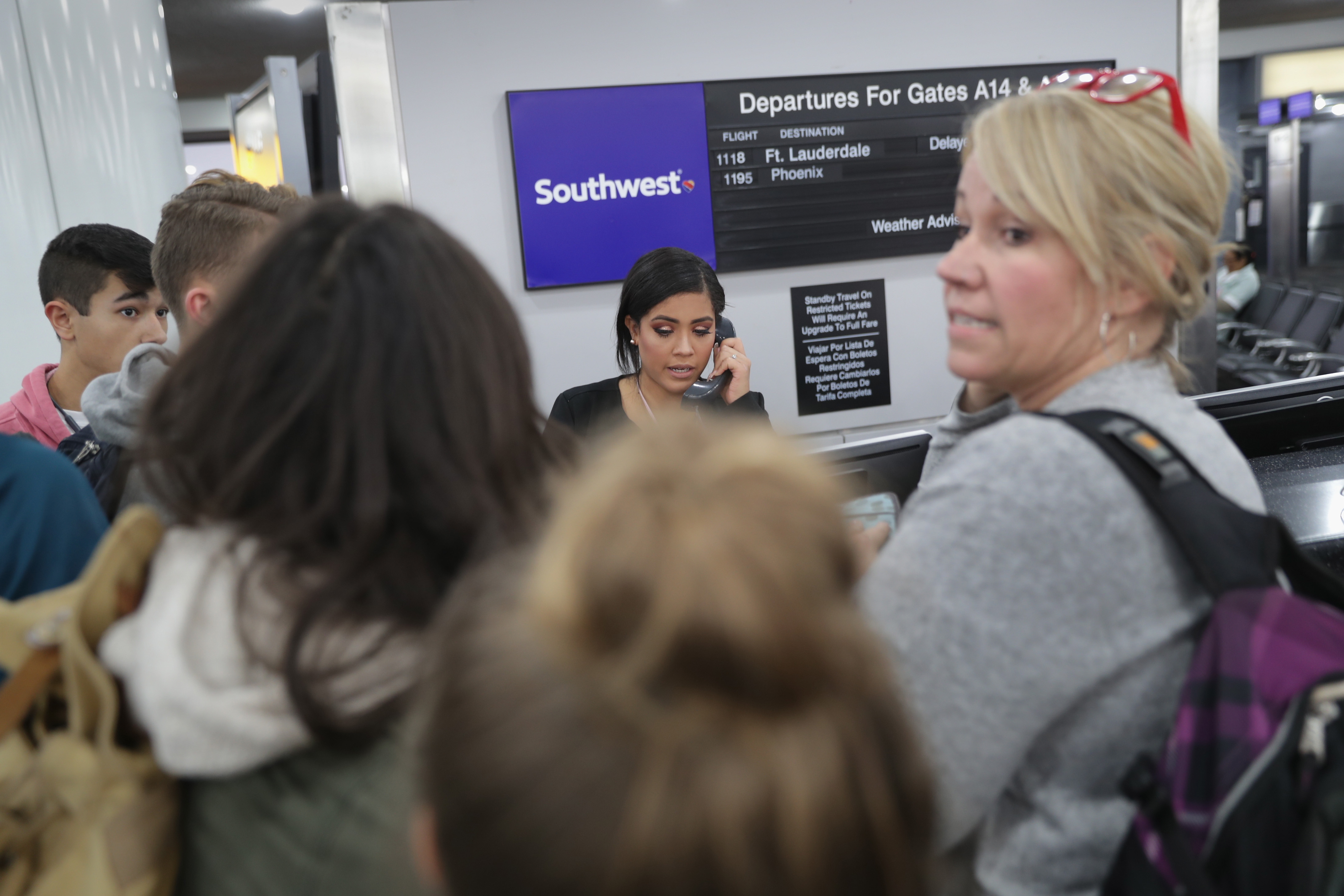 Passengers wait to rebook after their flights were cancelled due to a snow storm at the Newark Liberty International Airport on Nov. 15, 2018, in Newark, New Jersey. (Credit: John Moore/Getty Images)