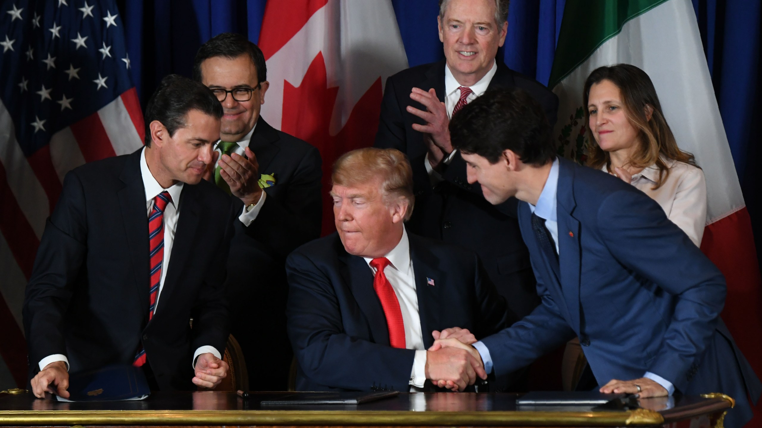 Mexican President Enrique Pena Nieto, US President Donald Trump and Canadian Prime Minister Justin Trudeau are pictured after signing a new free trade agreement in Buenos Aires, on Nov. 30, 2018, on the sidelines of the G20 Leaders' Summit. (Credit: Martin Bernetti/AFP/Getty Images)