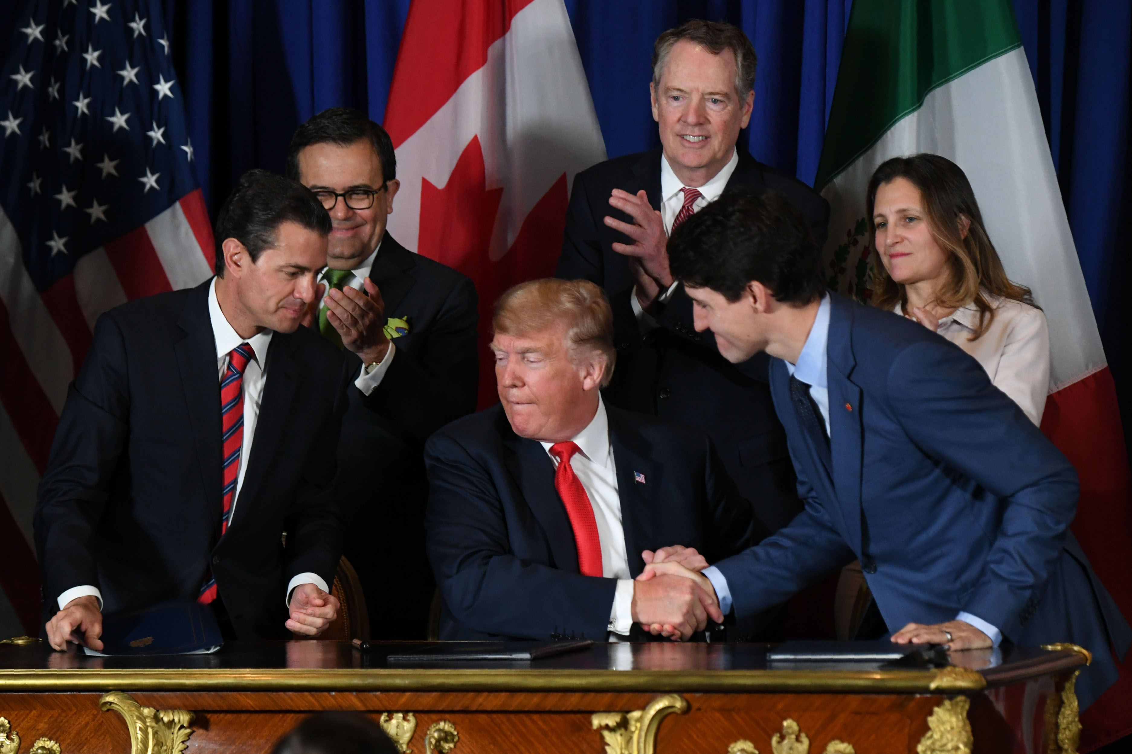 Mexican President Enrique Pena Nieto, US President Donald Trump and Canadian Prime Minister Justin Trudeau are pictured after signing a new free trade agreement in Buenos Aires, on Nov. 30, 2018, on the sidelines of the G20 Leaders' Summit. (Credit: Martin Bernetti/AFP/Getty Images)