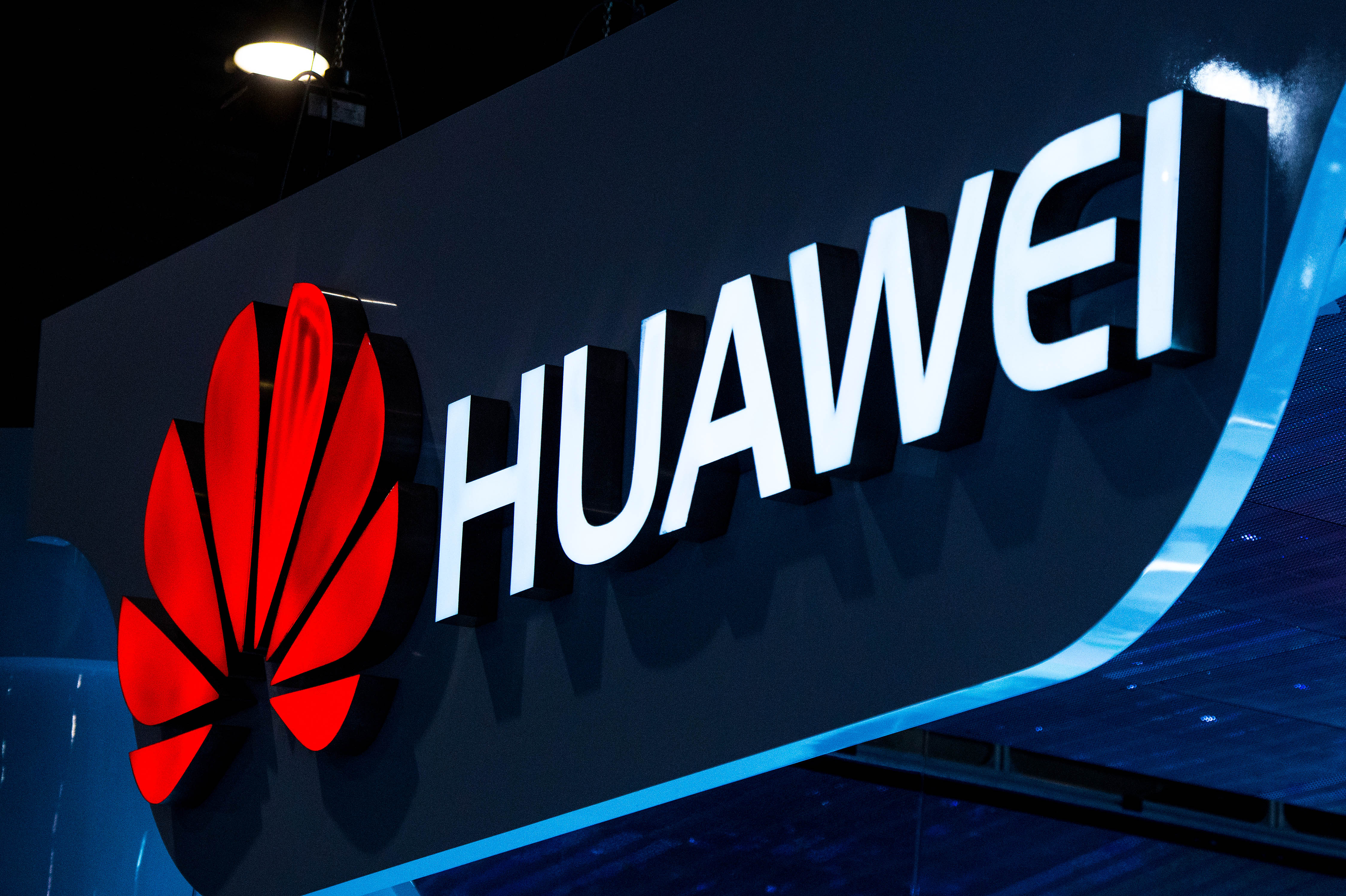 A logo sits illuminated outside the Huawei pavilion during the second day of the Mobile World Congress 2015 at the Fira Gran Via complex on March 3, 2015. (Credit: David Ramos/Getty Images)