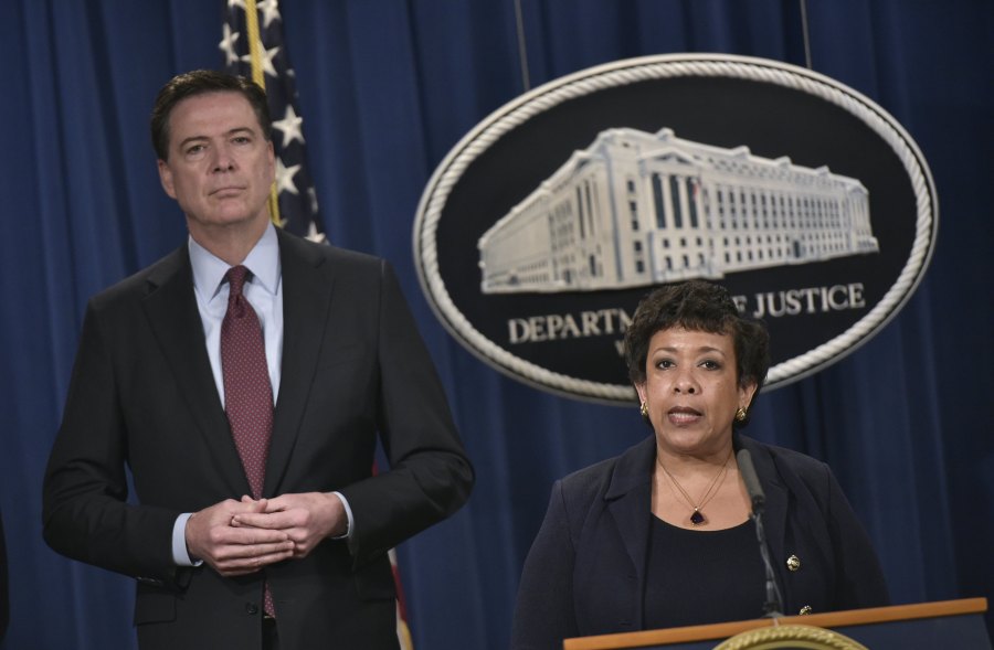 Loretta Lynch speaks during a press conference while James Comey listens at the Department of Justice on March 24, 2016 in Washington, D.C. (Credit: MANDEL NGAN/AFP/Getty Images)