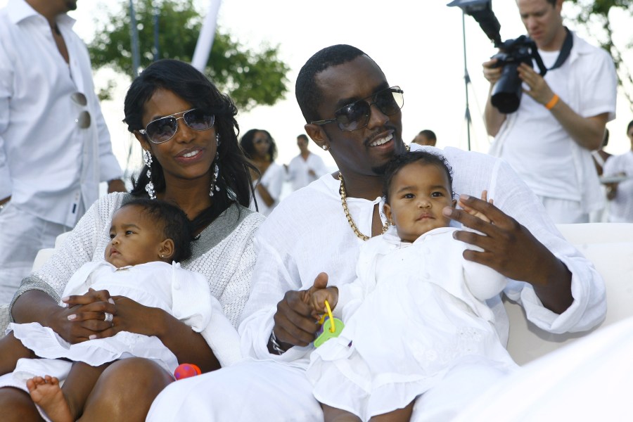 Host Sean "Diddy" Combs and Kim Porter, with their twin daughters D'Lila Star Combs and Jessie James Combs, attend "The Real White Party" at Combs' East Hampton estate on Sept. 2, 2007. (Credit: Mat Szwajkos / CP / Getty Images)