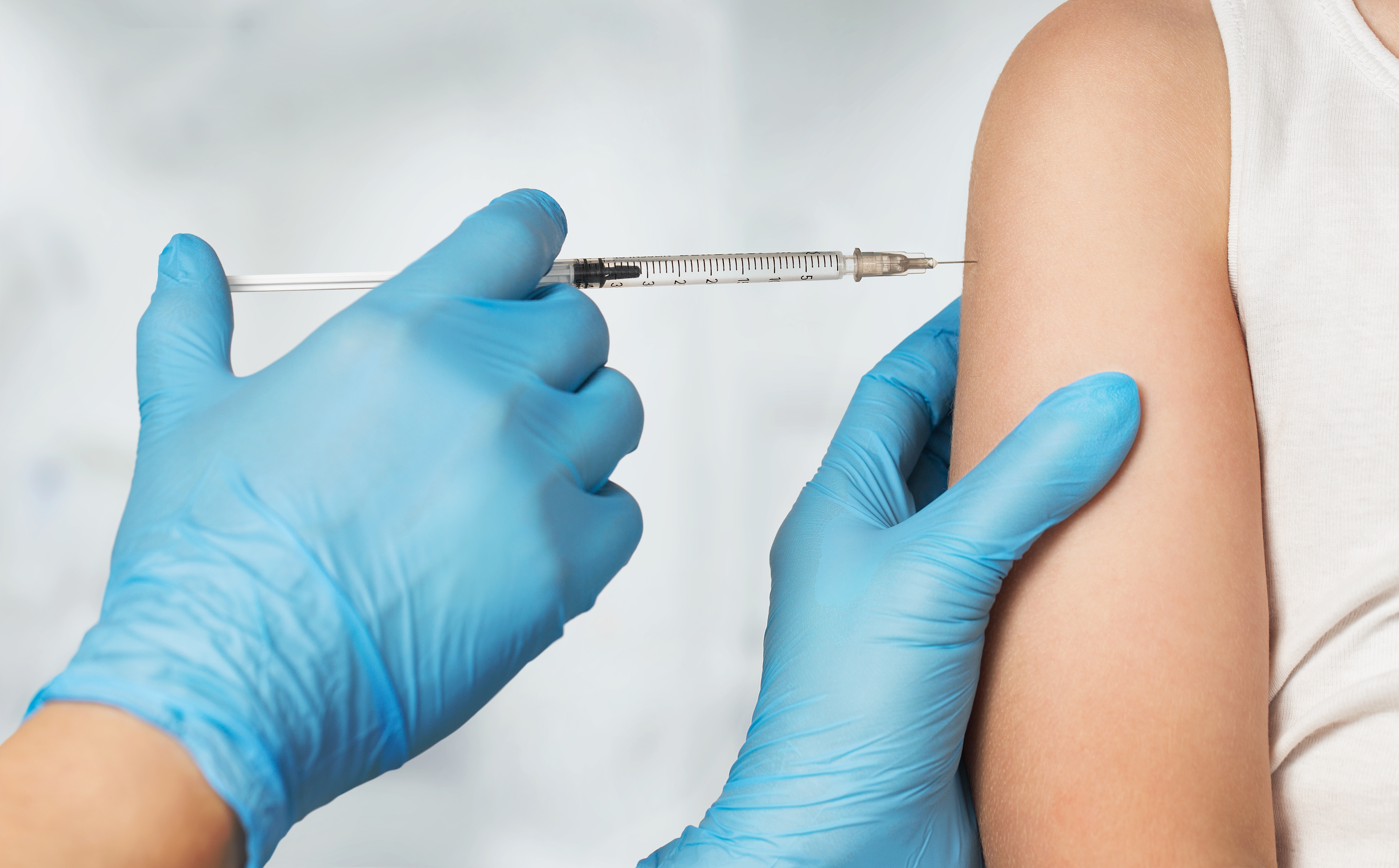 A child is seen getting a flu shot in this file photo. (Credit: iStock/Getty Images Plus)