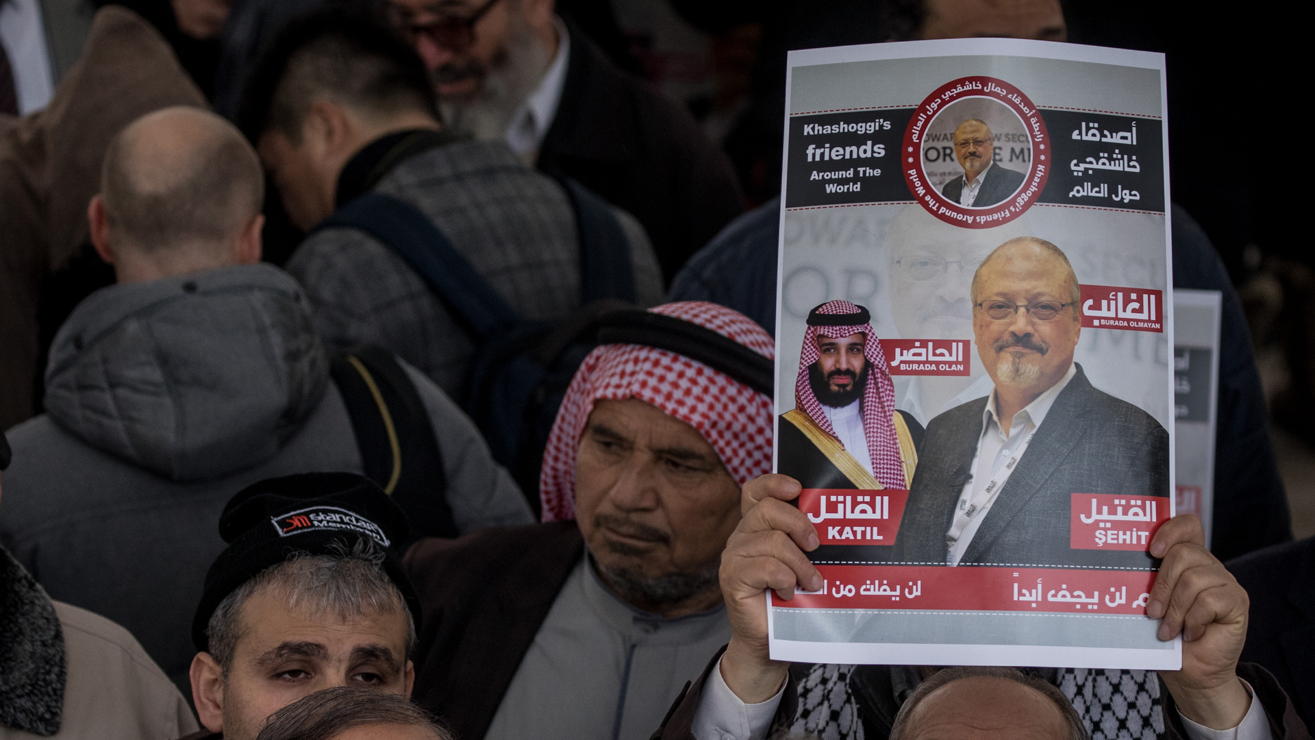 A man holds a poster showing a picture of Jamal Khashoggi after taking part in an absence prayer held after Friday pray at Fatih Mosque on Nov. 16, 2018, in Istanbul. (Credit: Chris McGrath/Getty Images)