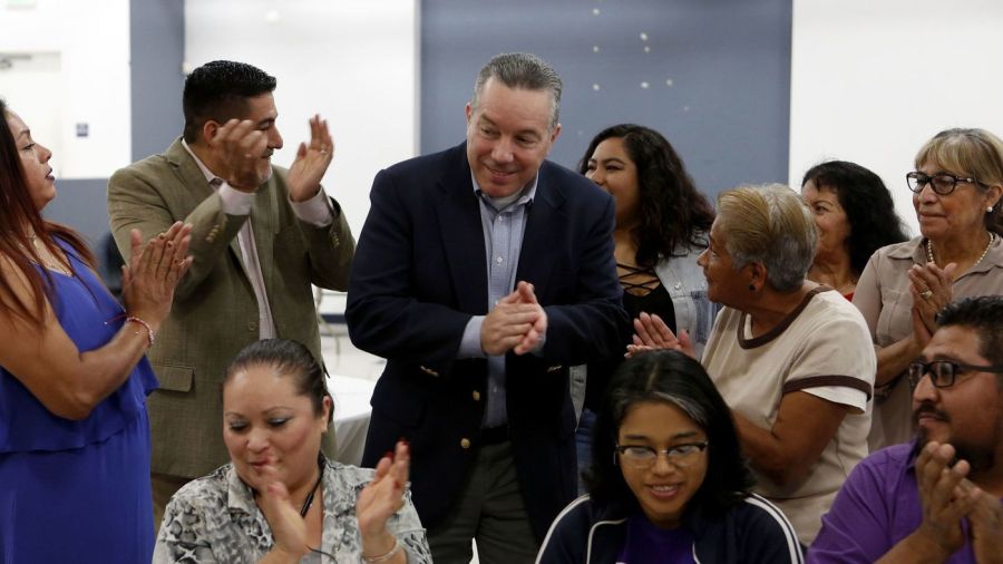 Alex Villanueva, center, is seen at a reception hosted by Citizens PAC and SEIU, groups that financially backed him in his bid for Los Angeles County sheriff, on Nov. 20, 2018. (Credit: Katie Falkenberg / Los Angeles Times)