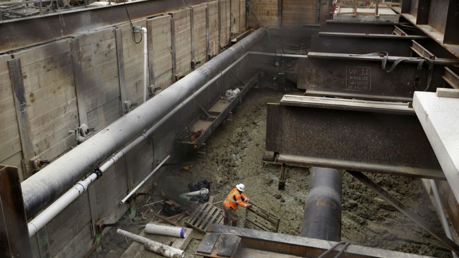 Crews work on the Metro Purple Line subway at La Brea and Wilshire in 2017. The $9-billion, nine-mile project will connect West Los Angeles to downtown by rail. (Credit: Glenn Koenig / Los Angeles Times)