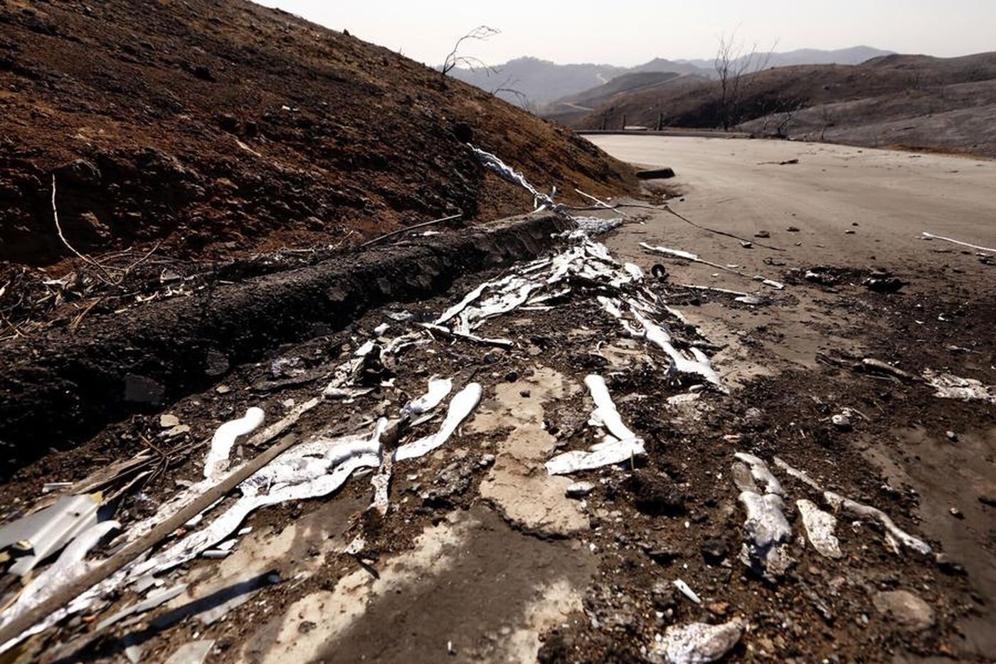 Melted metal is all that remains from a vehicle removed from the scene in Malibu where two people likely died in the Woolsey Fire, which erupted on Nov. 8, 2018. (Credit: Al Seib / Los Angeles Times)