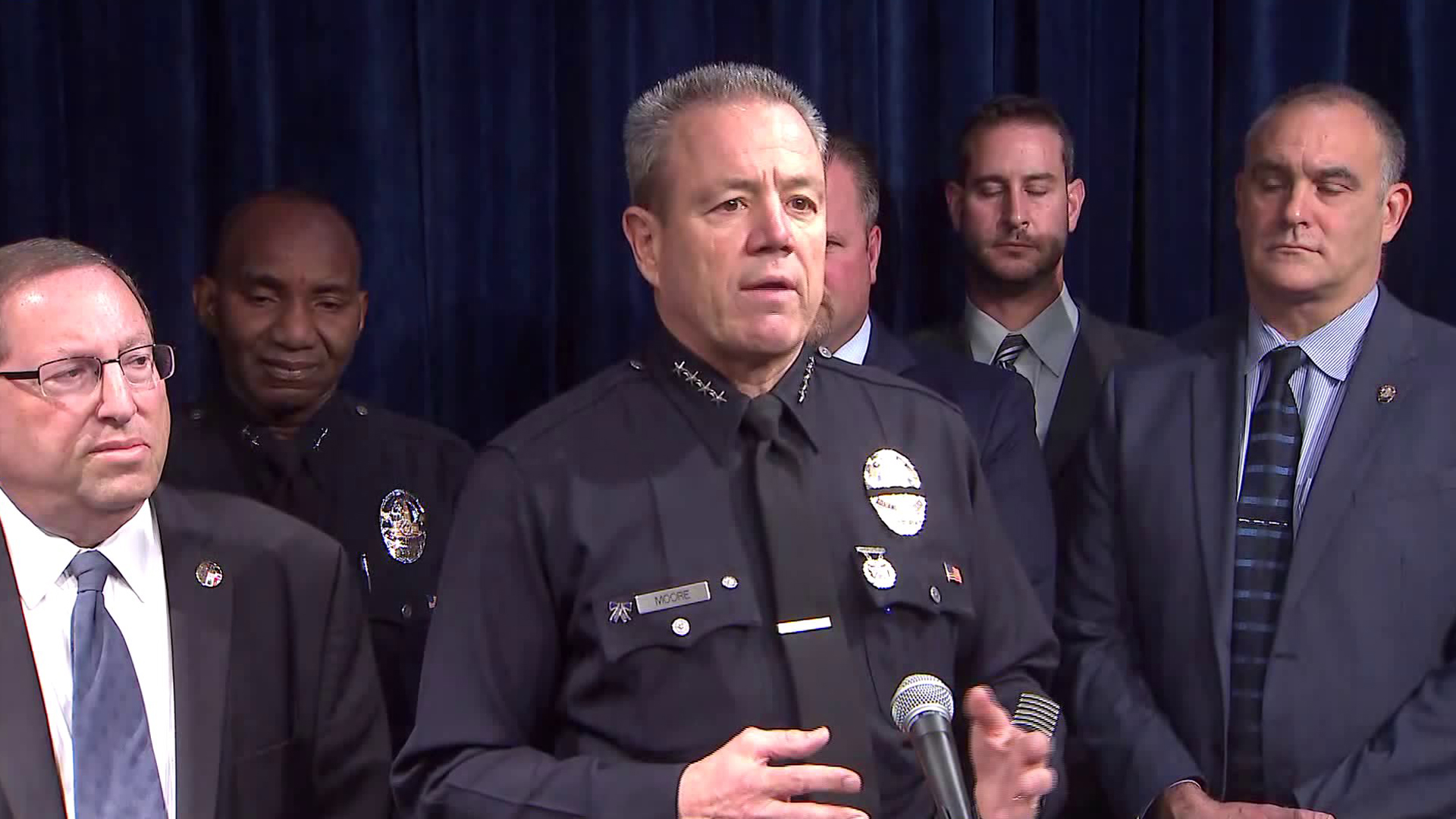 LAPD Chief Michel Moore (center) speaks during a news conference on Nov. 26, 2018. (Credit: KTLA)