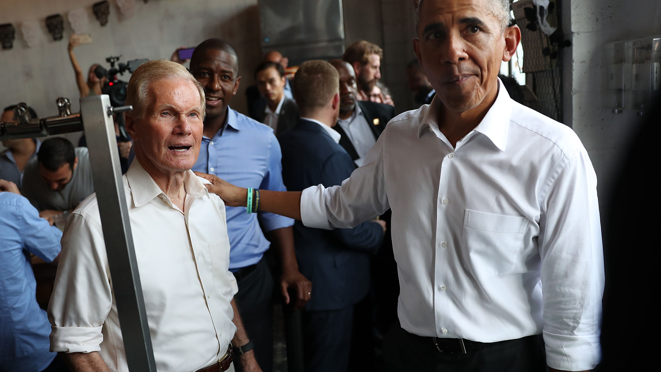 Former U.S. President Barack Obama orders lunch with U.S. Senator Bill Nelson (D-FL) and Florida Democratic gubernatorial candidate Andrew Gillum at the Coyo Taco restaurant on November 02, 2018 in Miami, Florida. (Credit: Joe Raedle/Getty Images)