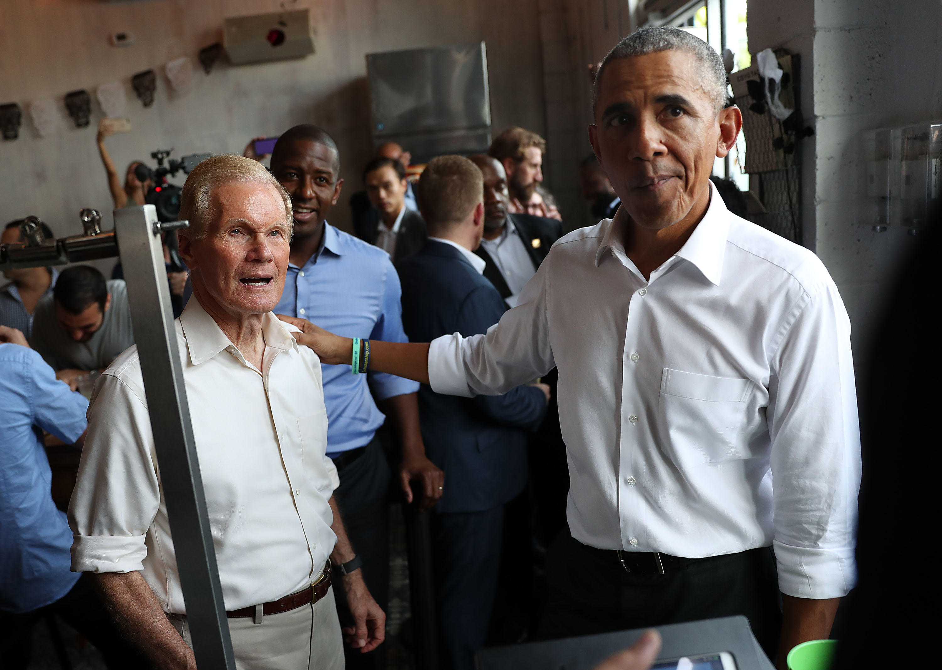 Former U.S. President Barack Obama orders lunch with U.S. Senator Bill Nelson (D-FL) and Florida Democratic gubernatorial candidate Andrew Gillum at the Coyo Taco restaurant on November 02, 2018 in Miami, Florida. (Credit: Joe Raedle/Getty Images)