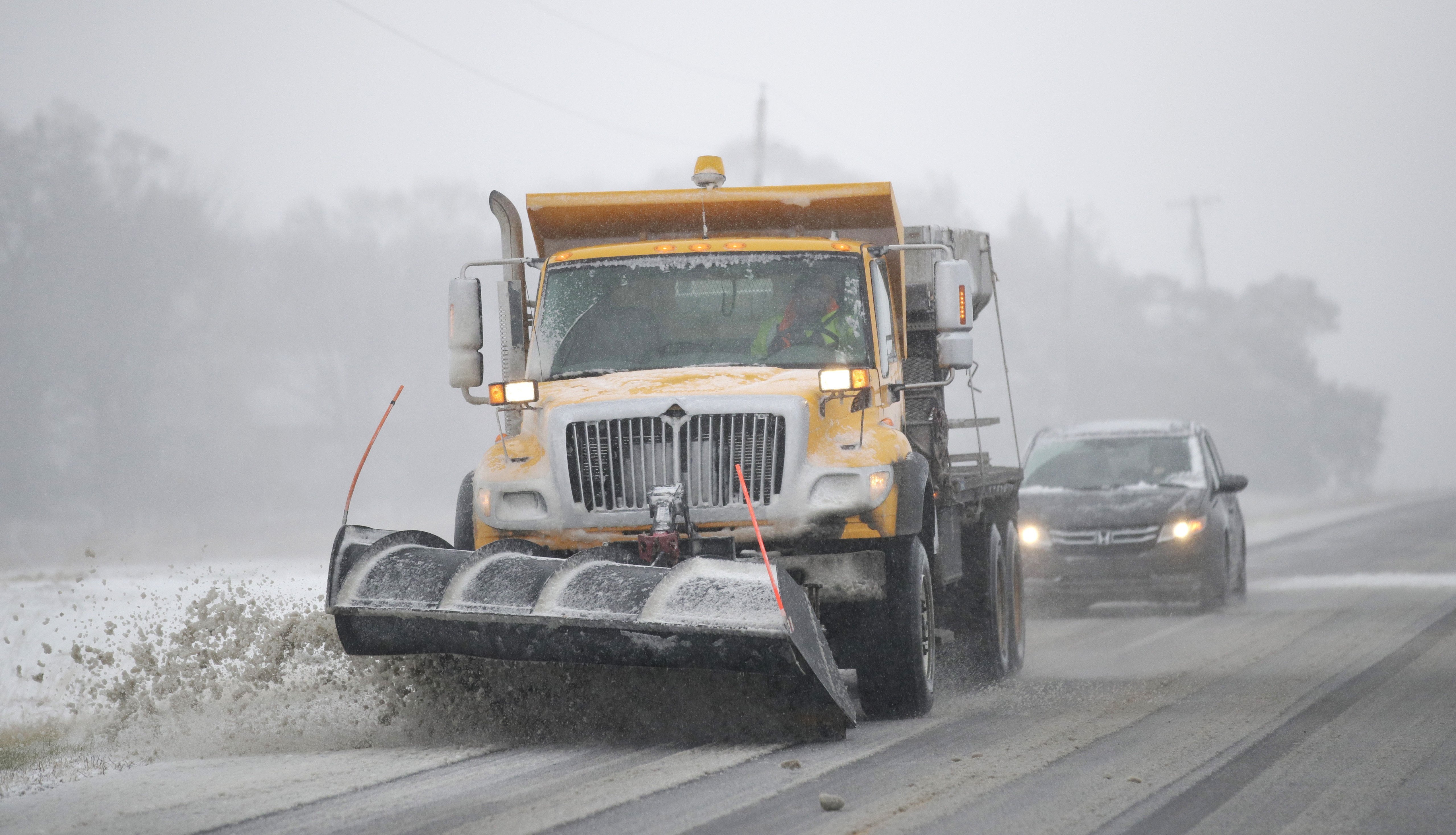 A plow clears snow from in Douglas County, Kansas, Sunday. (Credit: Associated Press via CNN Wire)