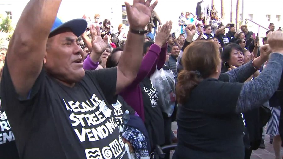 Supporters celebrate the passage of a law legalizing and regulating street vending in Los Angeles on Nov. 28, 2018. (Credit: KTLA)