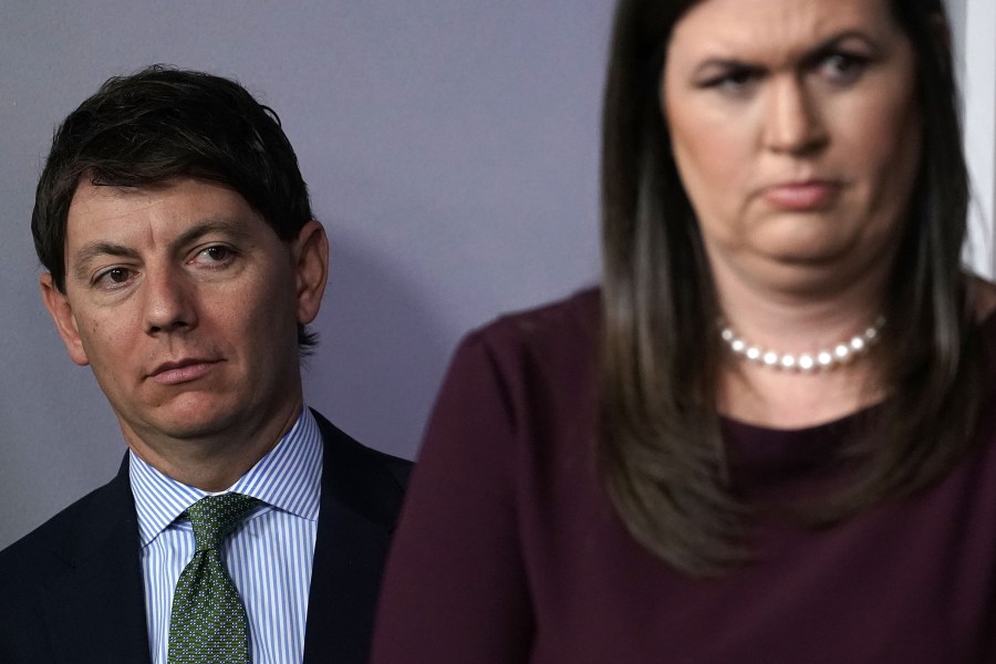 White House Press Secretary Sarah Sanders, right, and White House Deputy Press Secretary Hogan Gidley listen during a White House news briefing on Oct. 3, 2018. (Credit: Alex Wong/Getty Images)