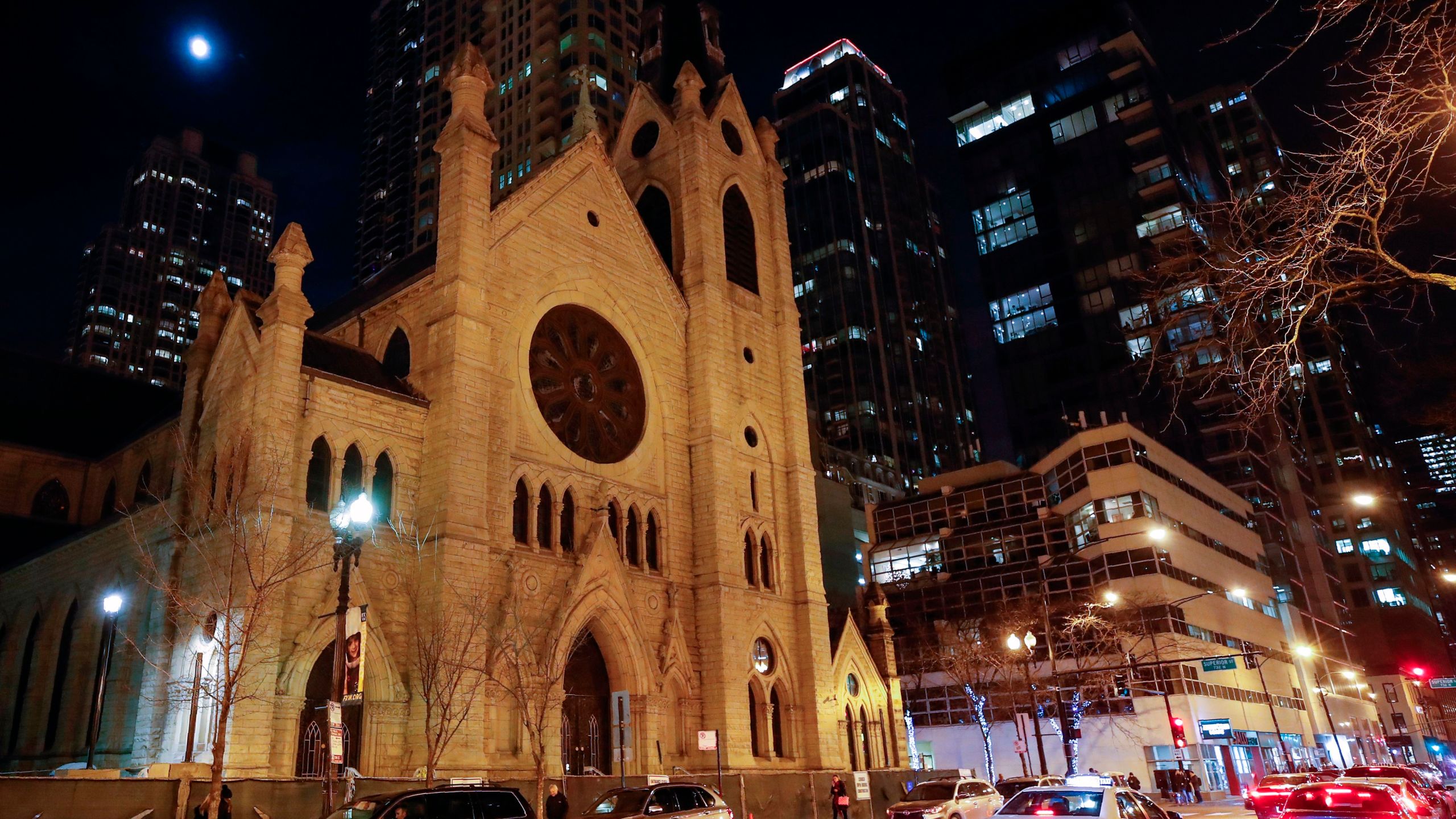 Cars drive past the Holy Name Cathedral in Chicago on Dec. 19, 2018. (Credit: Kamil Krzaczynski / AFP / Getty Images)