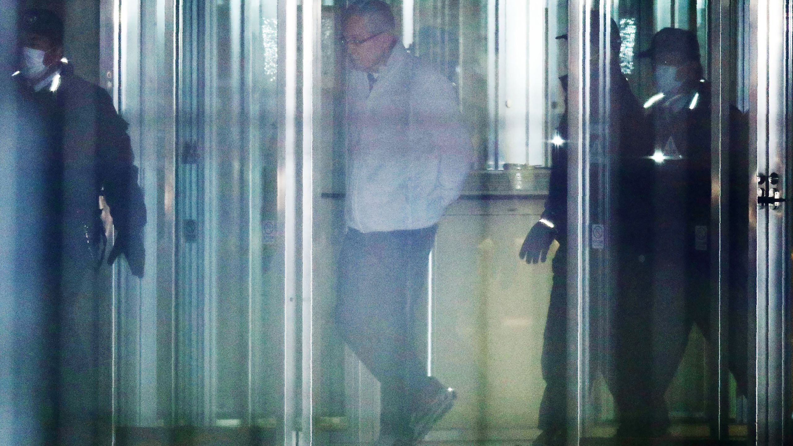 Greg Kelly (center) walks out of the Tokyo Detention House in Tokyo on Dec. 25, 2018. (Credit: Jiji Press/AFP/Getty Images)