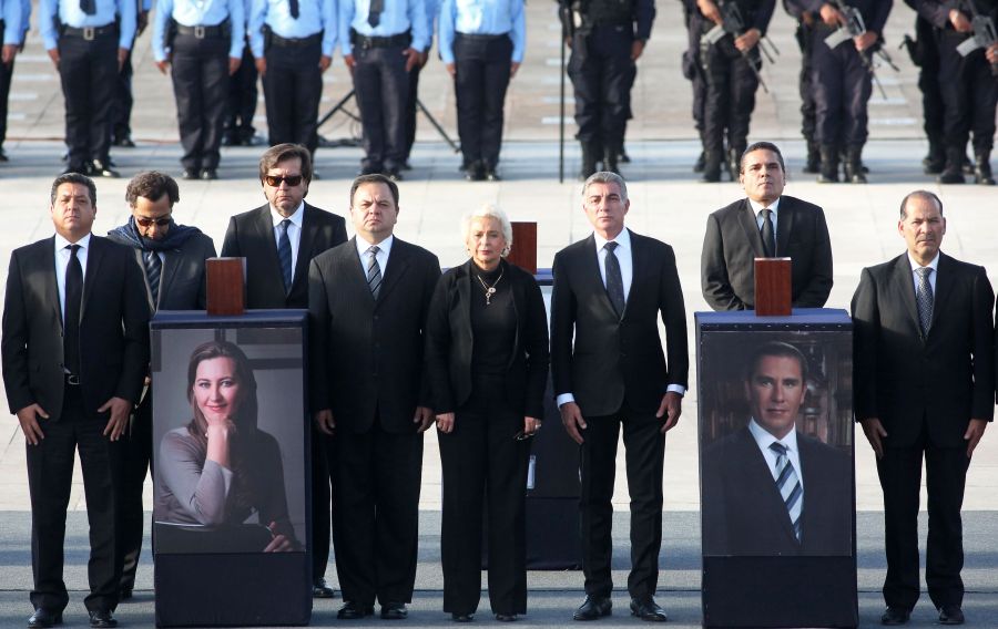 Mexican Interior Minister Olga Sanchez Cordero, center, participates in a ceremony at La Victoria square in Puebla on Dec. 25, 2018 in honor of the governor of the Mexican state of Puebla, Martha Erika Alonso, and her husband, senator and former governor of the same region, Rafael Moreno. (Credit: JOSE CASTANARES/AFP/Getty Images)