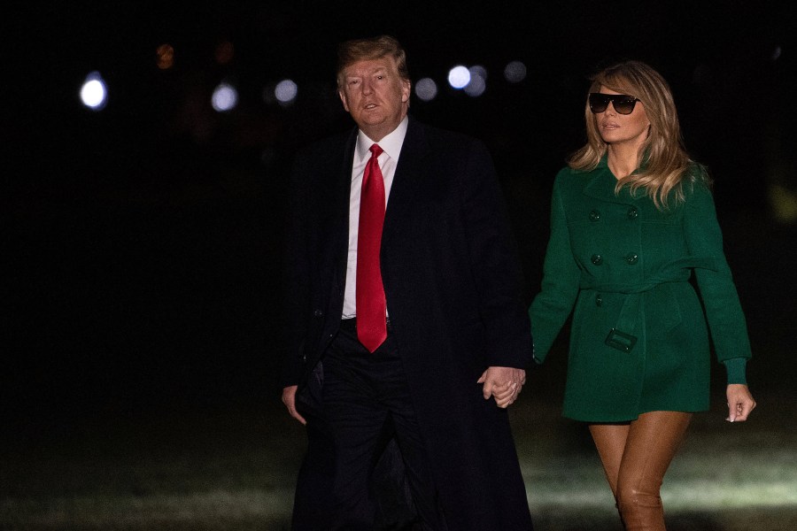 US President Donald Trump and First Lady Melania Trump arrive at the White House in Washington, DC, on December 27, 2018, as they return from an unannounced trip to Iraq. (Credit: NICHOLAS KAMM/AFP/Getty Images)