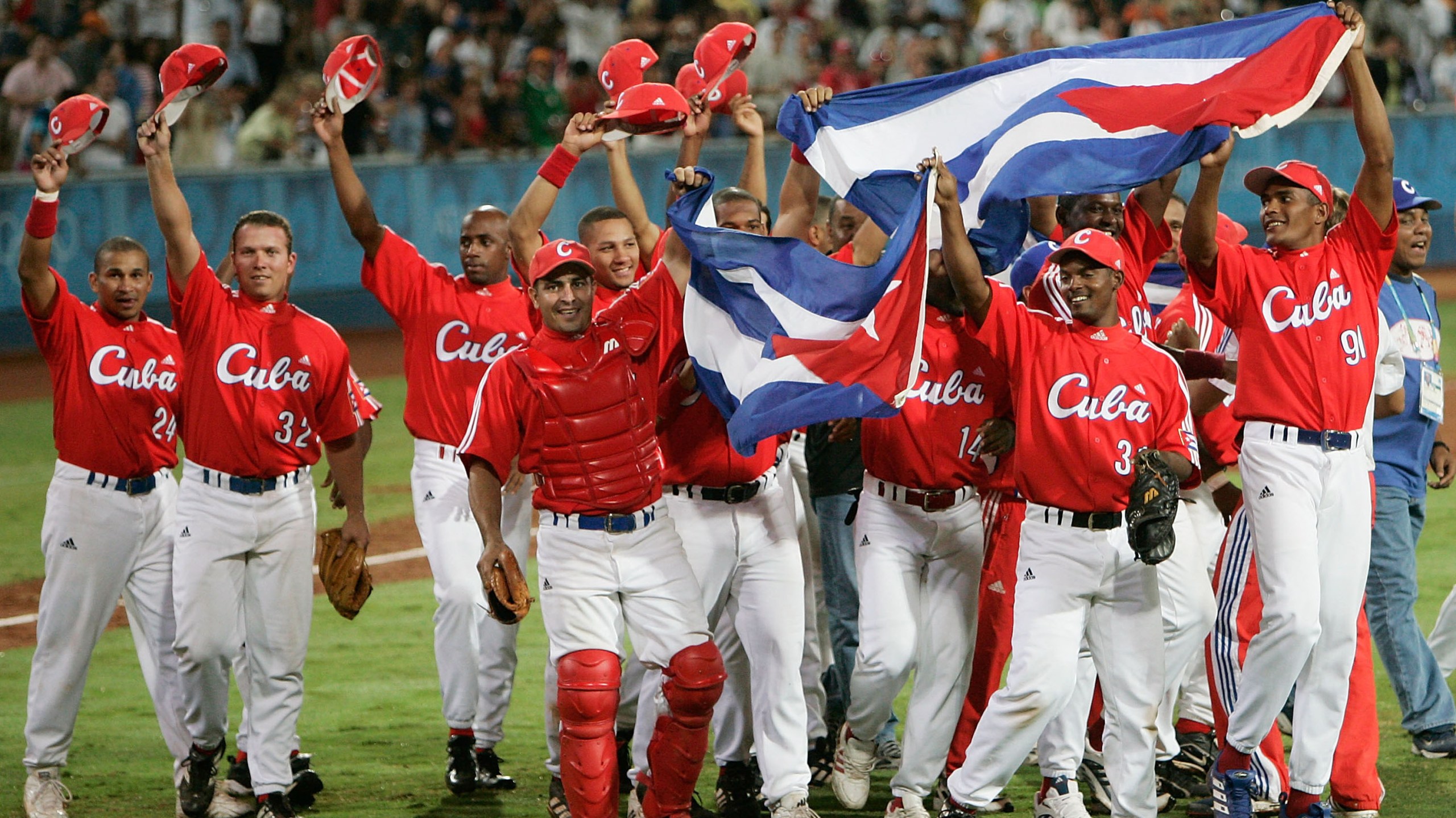 Cuba celebrates their victory over Australia in the gold medal baseball game on August 25, 2004 during the Athens 2004 Summer Olympic Games at the Baseball Centre in the Helliniko Olympic Complex in Athens, Greece. (Credit: Donald Miralle/Getty Images)