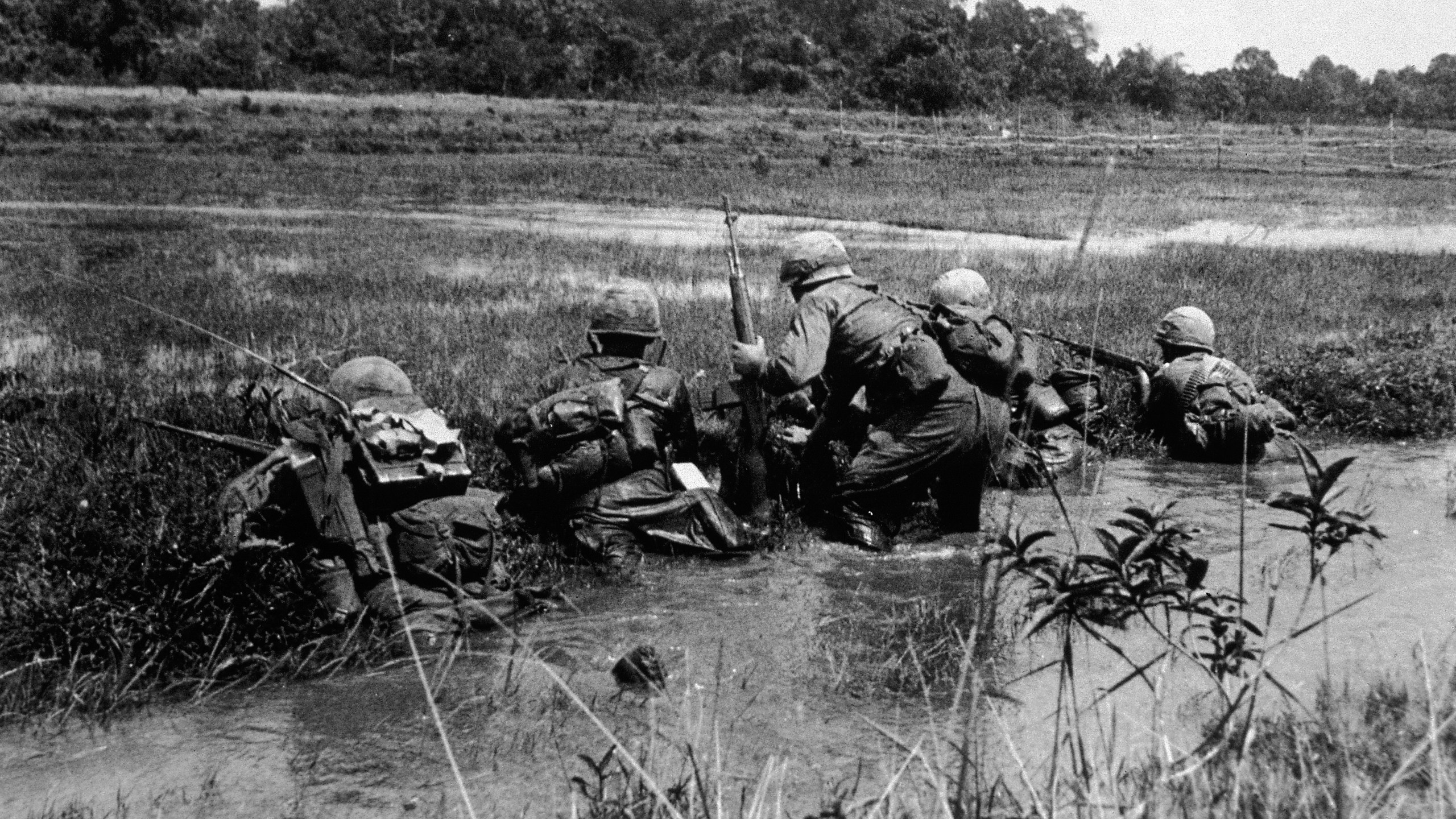 American army combat platoon leader Second Lieutenant John Libs (center) of 2nd platoon, C Company, 2d Battalion, 16th Infantry Regiment, 1st Division, surveys the situation in Vietnam, mid 1960s. (Credit: Hulton Archive/Getty Images)