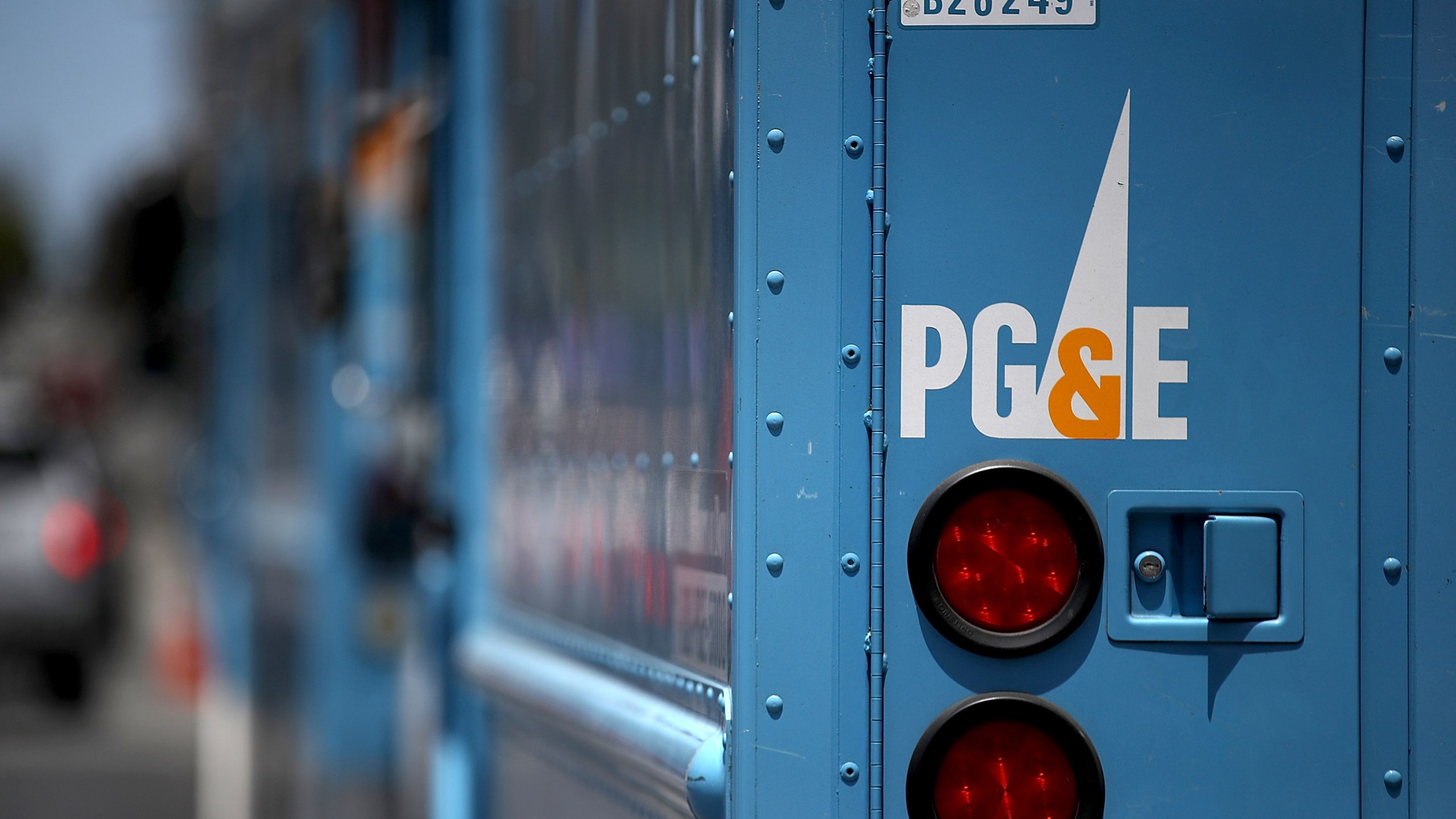 Pacific Gas and Electric trucks sit parked on a street on June 18, 2018, in San Francisco. (Credit: Justin Sullivan/Getty Images)