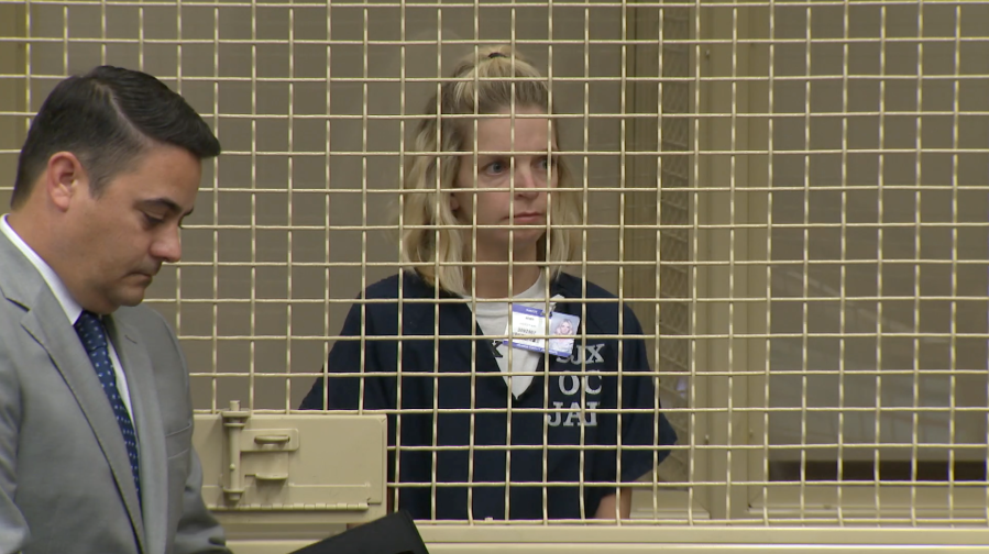 Ashley Bemis, charged with defrauding people donating to wildfire relief, appears for her arraignment in a Santa Ana courtroom on Dec. 21, 2018. (Credit: KTLA)