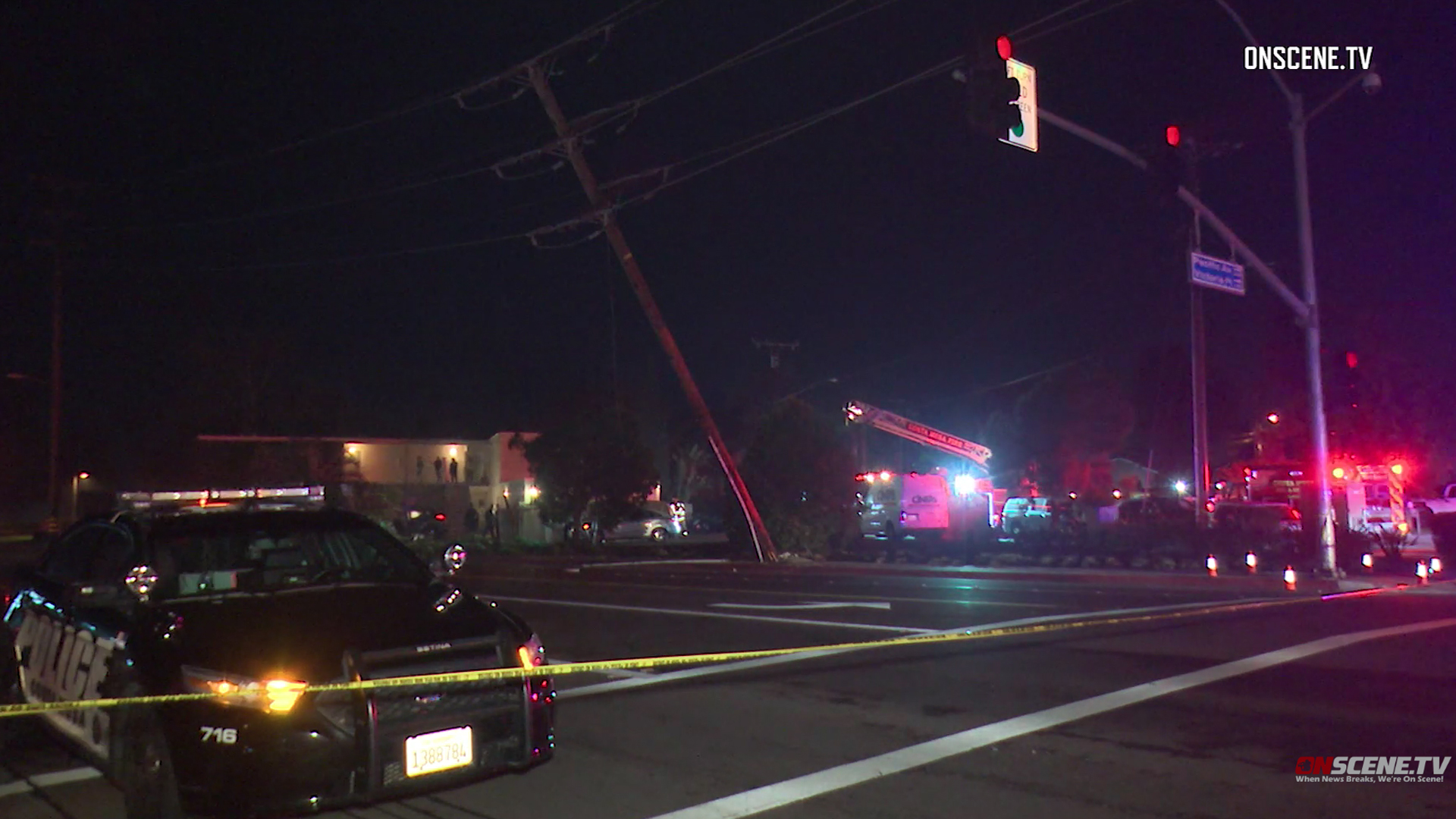 A utility pole is seen leaning following a fatal SUV crash in Costa Mesa on Dec. 8, 2018. (Credit: Onscene.tv)