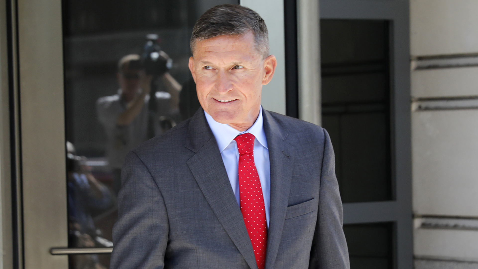 Michael Flynn, former national security advisor to President Donald Trump, departs the E. Barrett Prettyman United States Courthouse following a pre-sentencing hearing July 10, 2018, in Washington, D.C. (Credit: Aaron P. Bernstein/Getty Images)