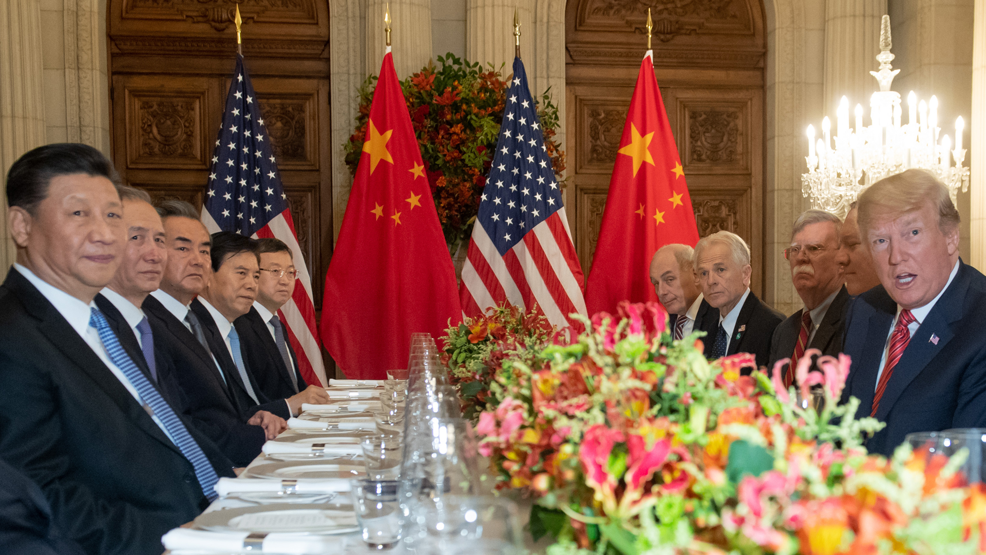 U.S. President Donald Trump and China's President Xi Jinping, along with members of their delegations, hold a dinner meeting at the end of the G20 Leaders' Summit in Buenos Aires, on Dec. 1, 2018. (Credit: SAUL LOEB/AFP/Getty Images)