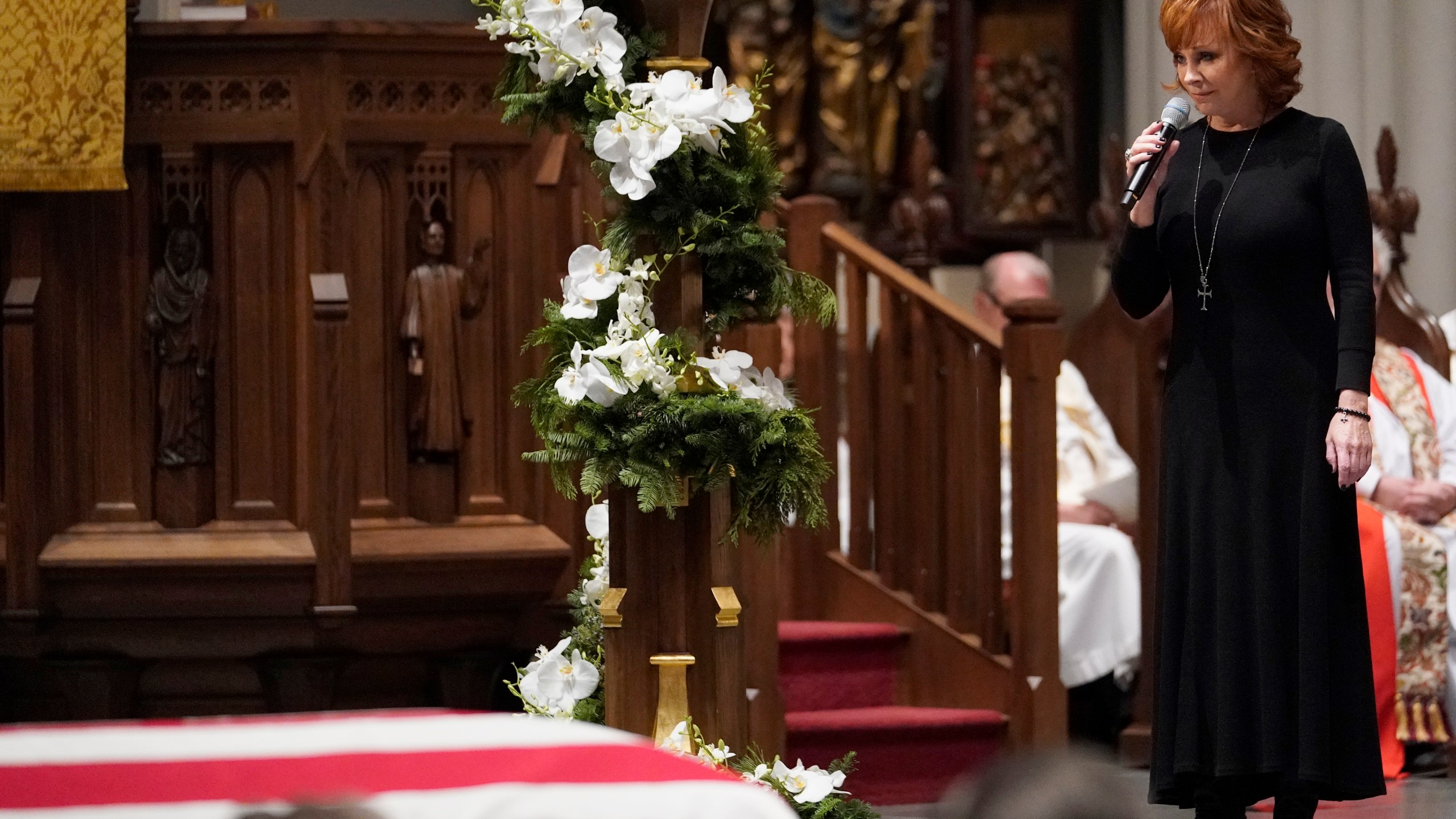 Reba McEntire sings 'The Lord's Prayer' during a funeral service for former President George H.W. Bush at St. Martins Episcopal Church on December 6, 2018 in Houston, Texas. (Credit: David J. Phillip-Pool/Getty Images)