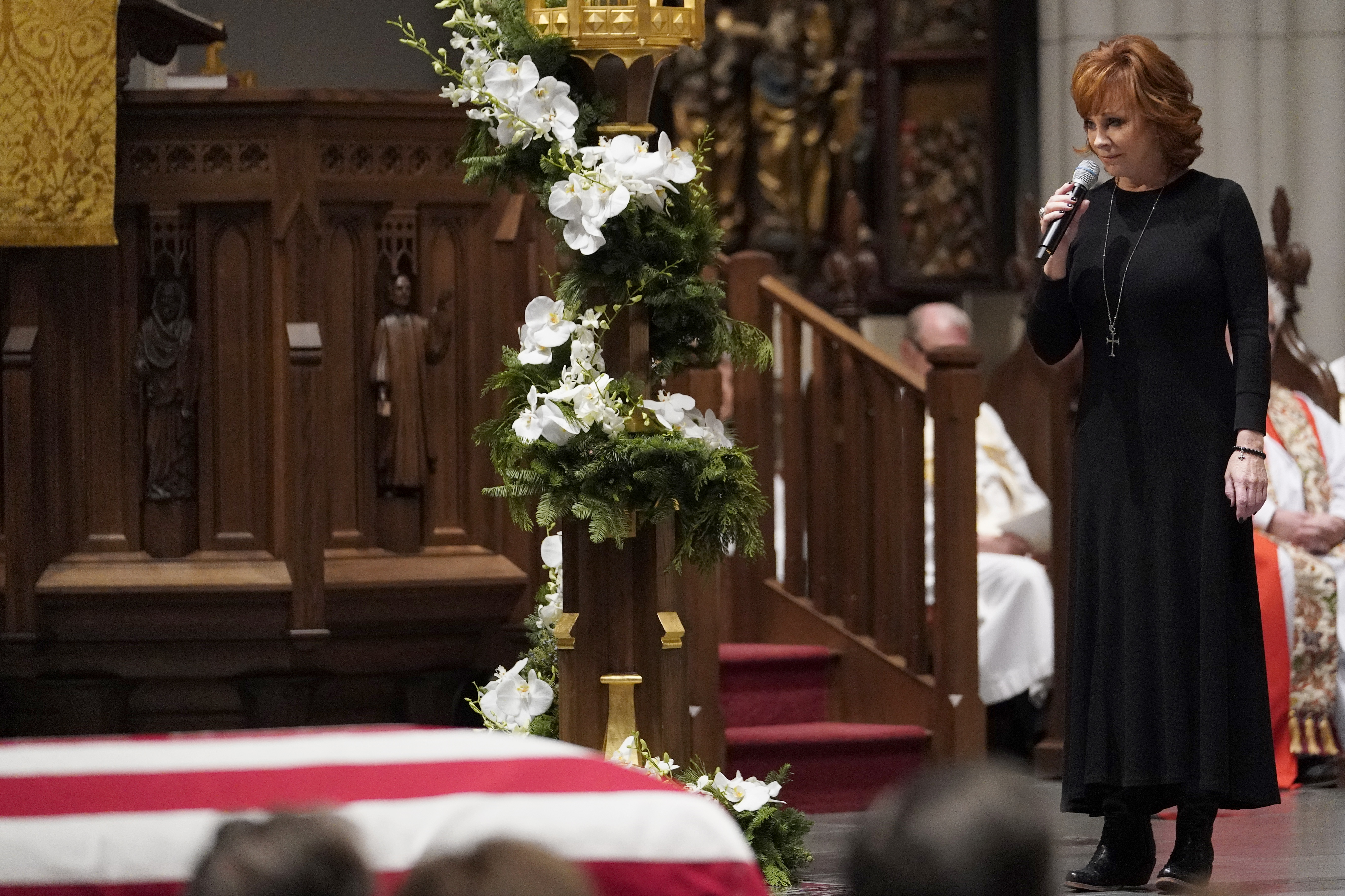 Reba McEntire sings 'The Lord's Prayer' during a funeral service for former President George H.W. Bush at St. Martins Episcopal Church on December 6, 2018 in Houston, Texas. (Credit: David J. Phillip-Pool/Getty Images)