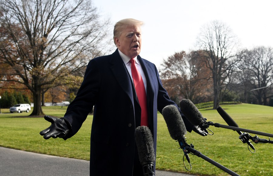 Donald Trump answers questions from the press while departing the White House on Dec. 8, 2018. (Credit: Olivier Douliery-Pool/Getty Images)