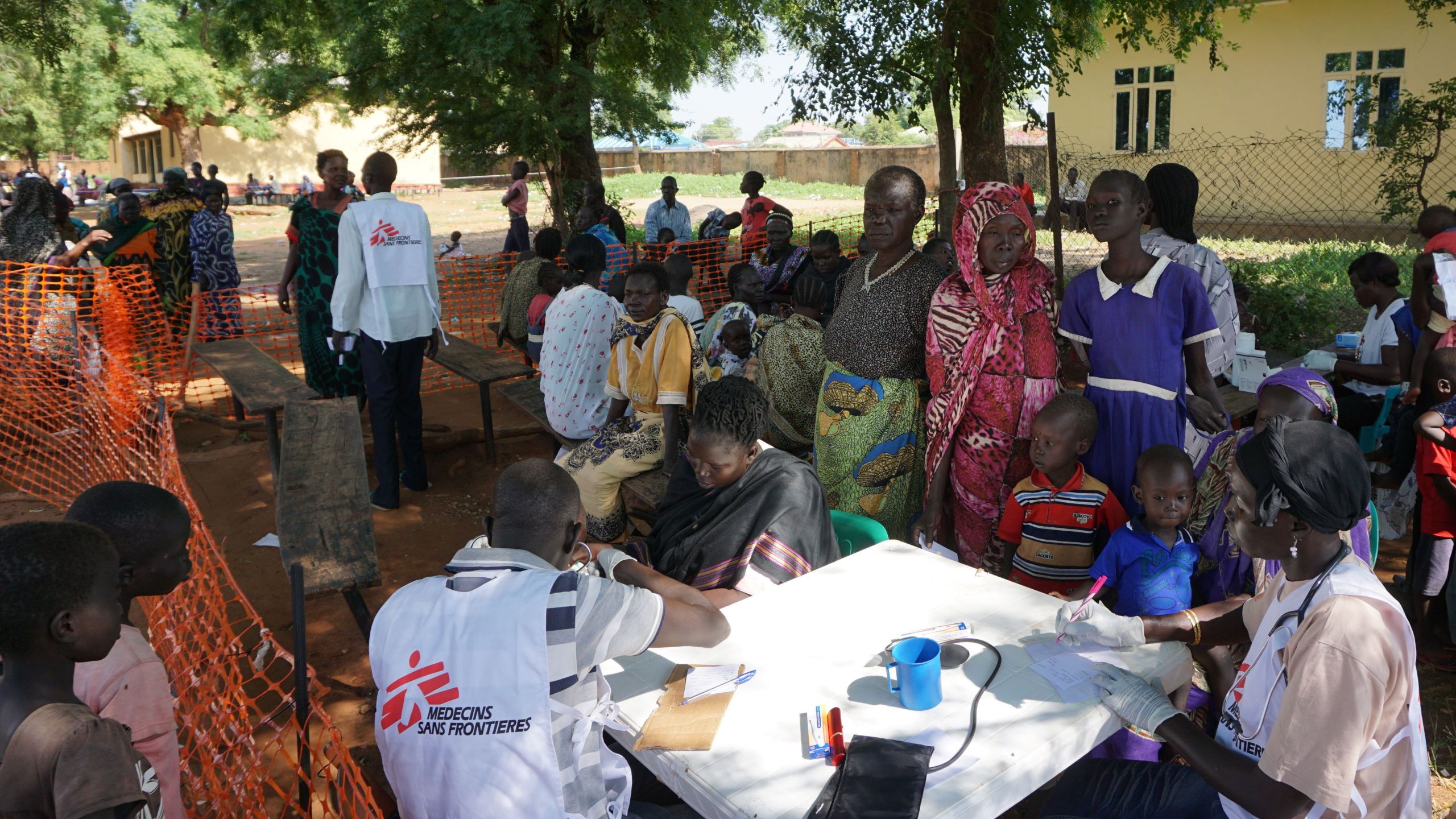 Medics from aid agency Doctors Without Borders (MSF) treat patients at a makeshift clinic in the grounds of the Catholic Cathedral in the South Sudanese capital Juba on July 15, 2016, after days of fighting left hundreds dead and forced thousands to flee their homes. (Credit: PETER MARTELL/AFP/Getty Images)