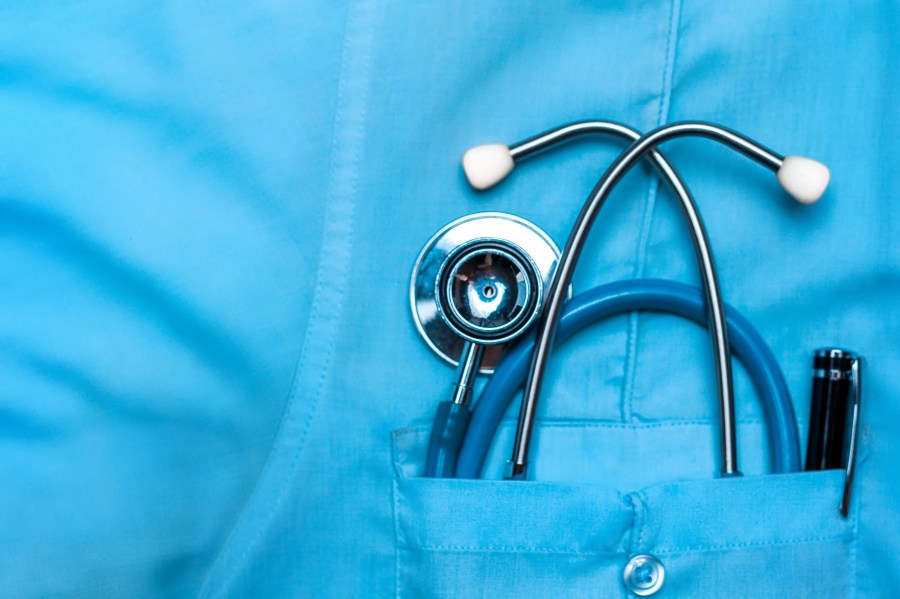 A stethoscope and a pen are seen in a doctor's robe pocket in this file photo. (Credit: Getty Images)