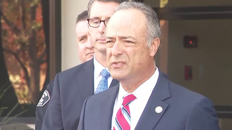 Nicola T. Hanna speaks to the media in front of the FBI offices in Orange on Dec. 12, 2018. (Credit: KTLA)