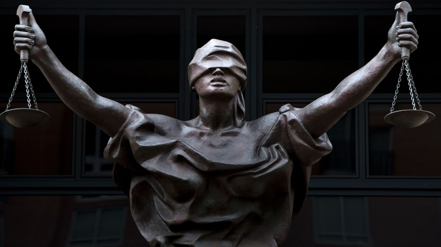 A statue of Justice at the Albert V. Bryan United States Courthouse in Alexandria, Virginia