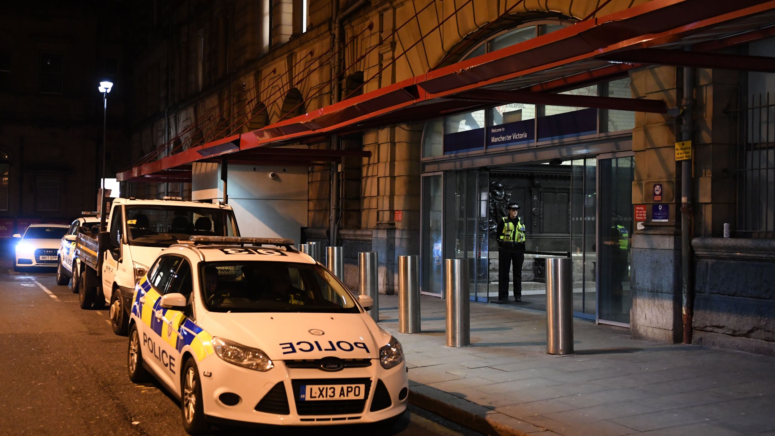 Police officers stand near a cordon at Manchester Victoria Station, in Manchester on January 1, 2019, following a stabbing on December 31, 2018. (Credit: PAUL ELLIS/AFP/Getty Images)