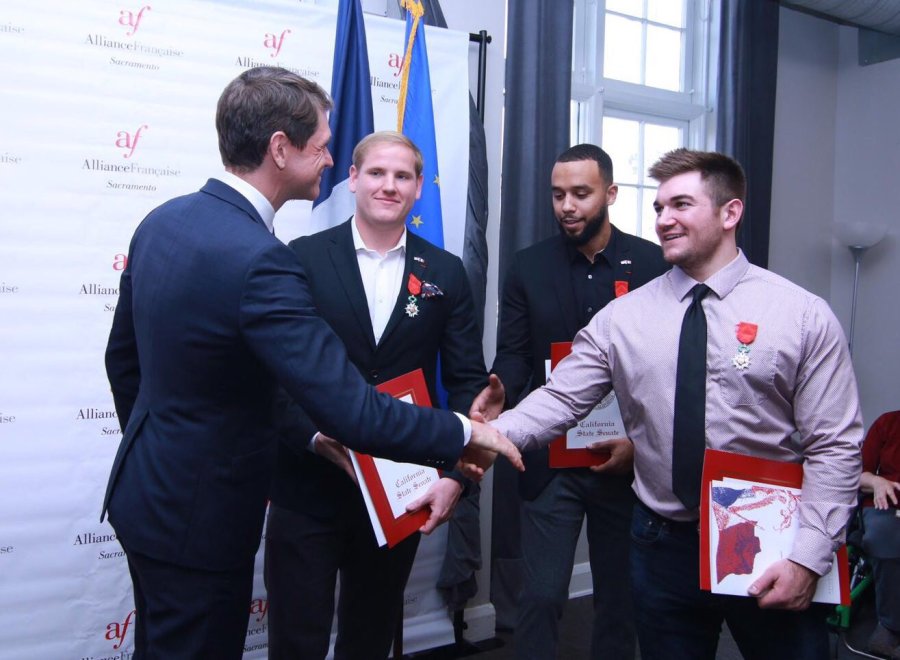 From left: French Consul General Emmanuel Lebrun-Damiens congratulates Spencer Stone, Anthony Sadler and Alek Skarlatos during a naturalization ceremony in Sacramento on Jan. 31, 2019, in a photo tweeted by the consul general.