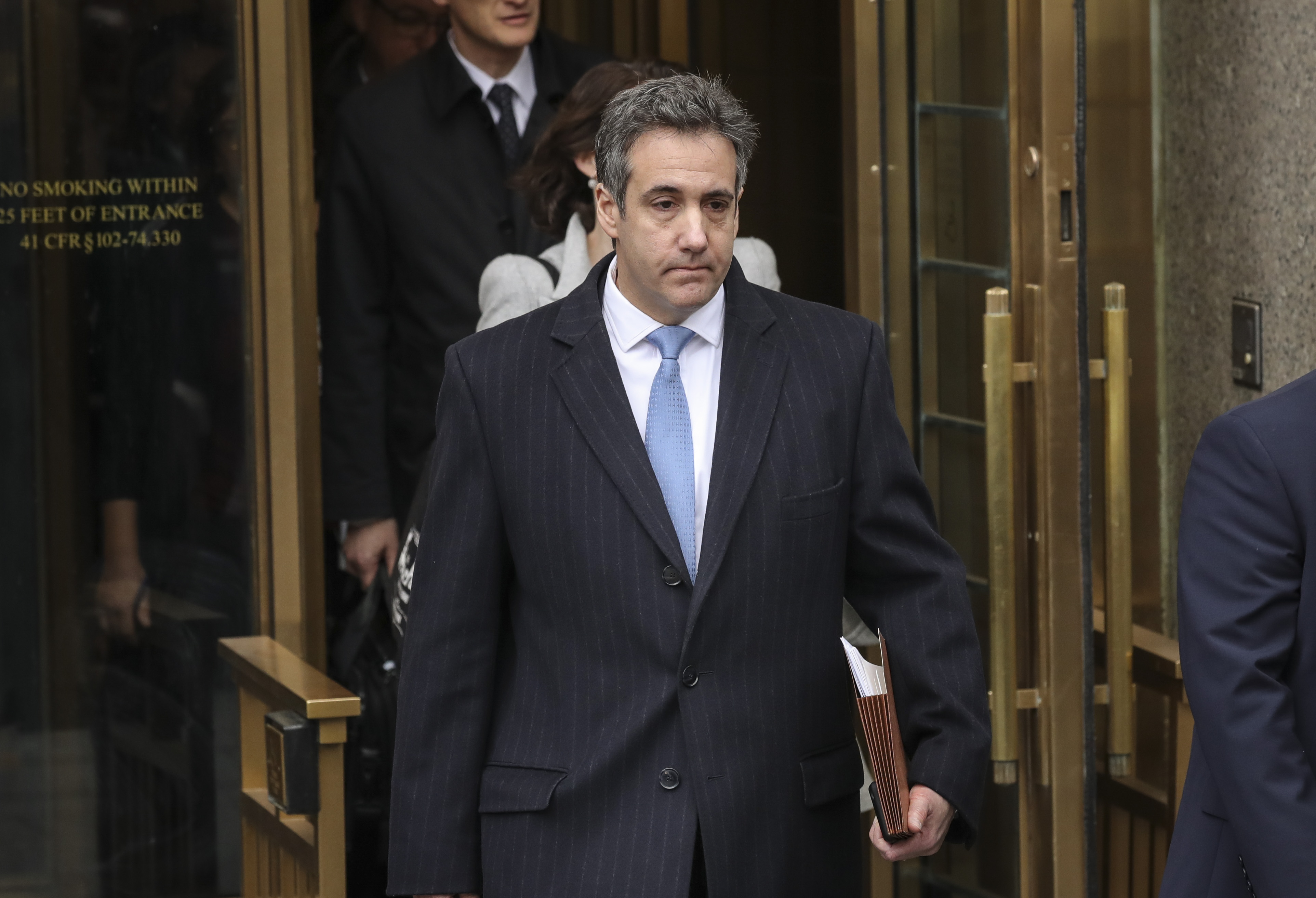 Michael Cohen, President Donald Trump's former personal attorney and fixer, exits federal court in New York City after his sentencing hearing on Dec. 12, 2018. (Credit: Drew Angerer / Getty Images)