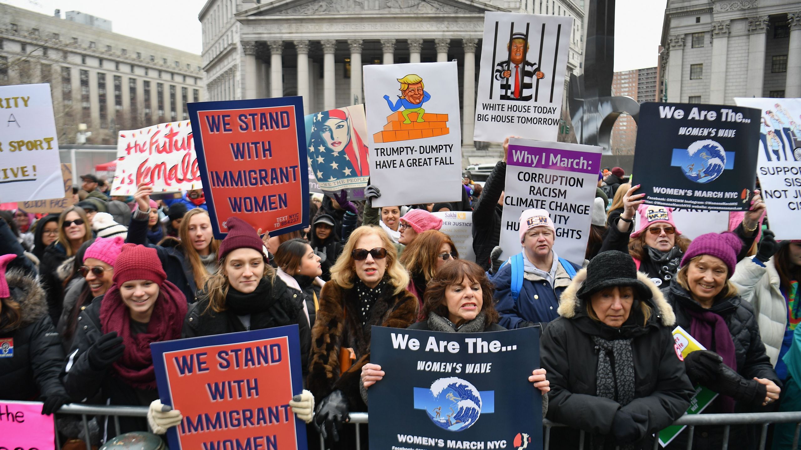 Protesters hold signs during the Women's Unity Rally at Foley Square on January 19, 2019 in New York City. (Credit: ANGELA WEISS/AFP/Getty Images)