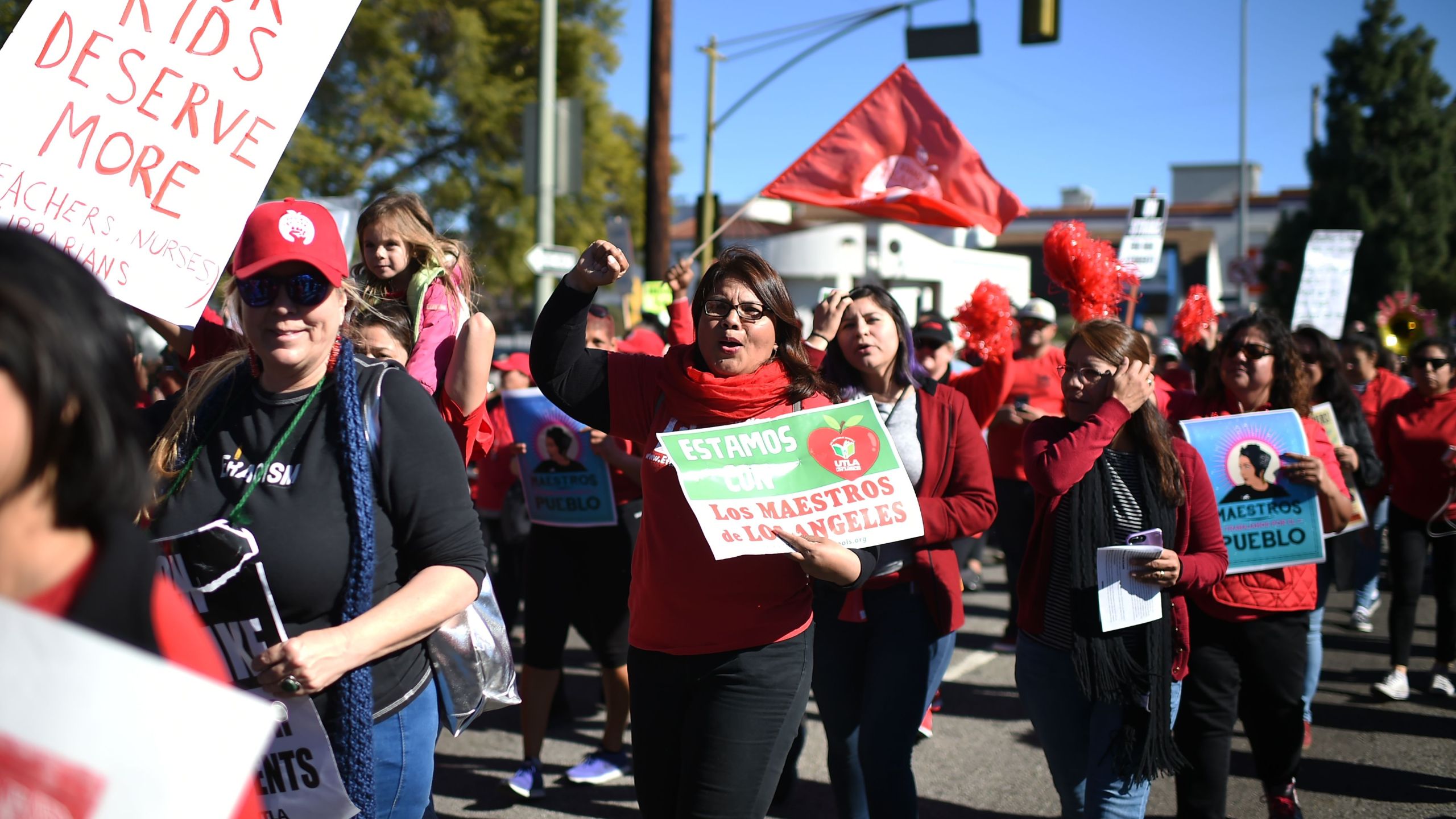 Striking public school teachers and their supporters march during the 34th annual Kingdom Day Parade on Martin Luther King Jr. Day on Jan. 21, 2019. (Credit: Robyn Beck / AFP/Getty Images)