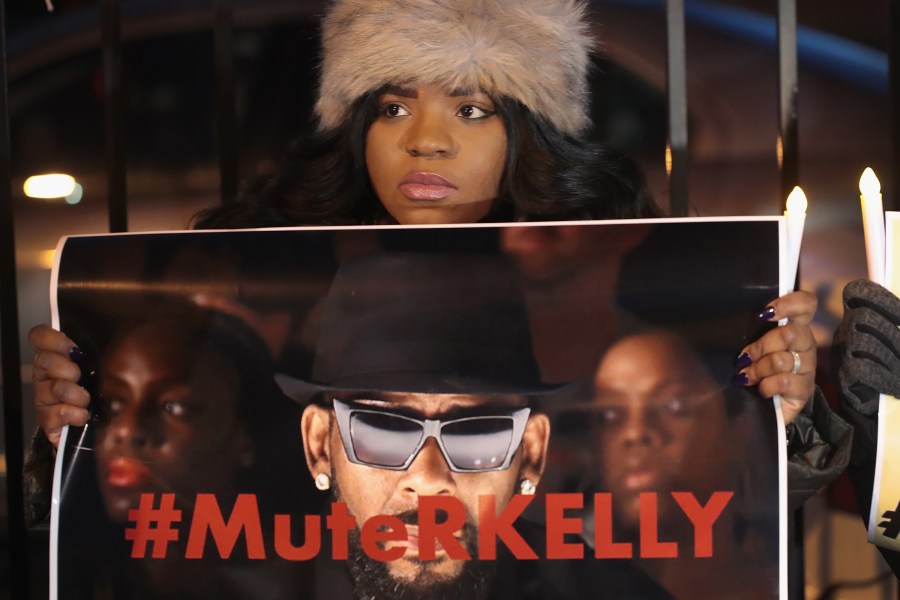 Demonstrators gather near the Chicago studio of singer R. Kelly to call for a boycott of his music after allegations of sexual abuse against young girls were raised on the Lifetime mini-series "Surviving R. Kelly" on Jan. 9, 2019. (Credit: Scott Olson / Getty Images)