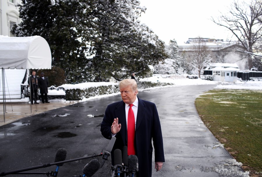 Donald Trump answers questions from the press as he departs the White House on Jan. 14, 2019. (Credit: Win McNamee/Getty Images)