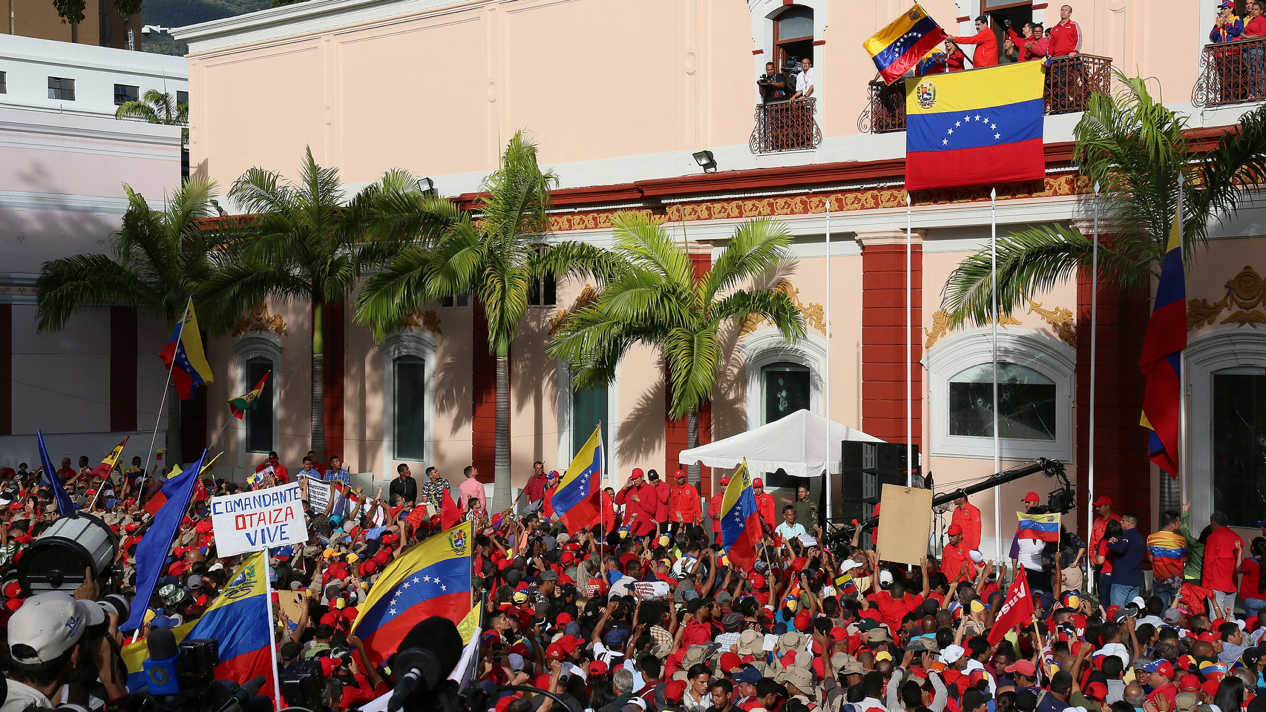 President of Venezuela Nicolás Maduro (center) gives a speech to his supporters form the Balcón del Pueblo of the Miraflores Government Palace on Jan. 23, 2019. (Credit: Edilzon Gamez/Getty Images)