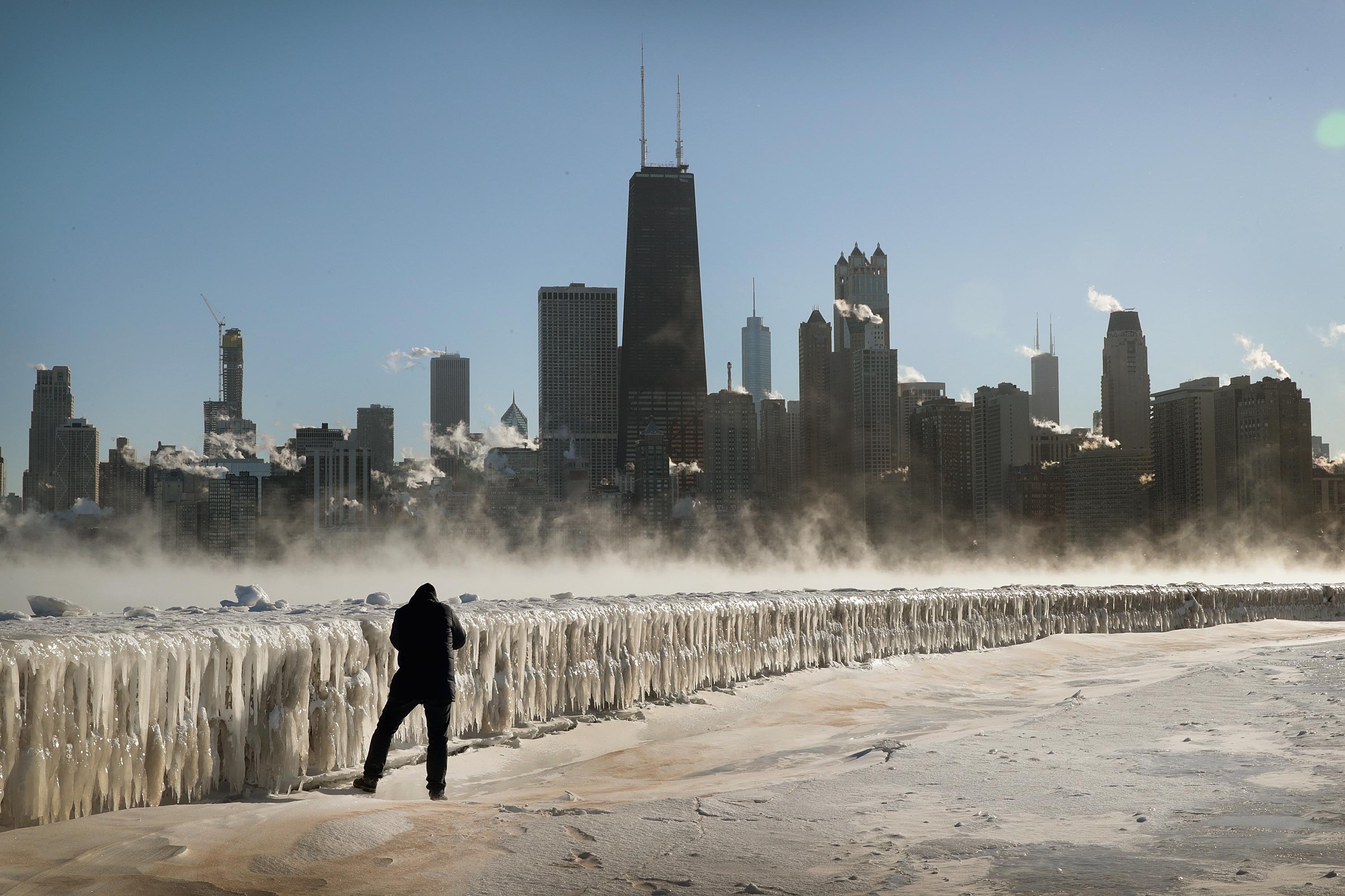 A man takes a picture along the lakefront as temperatures hovered around -20 degrees in Chicago on Jan. 30, 2019. (Credit: Scott Olson / Getty Images)