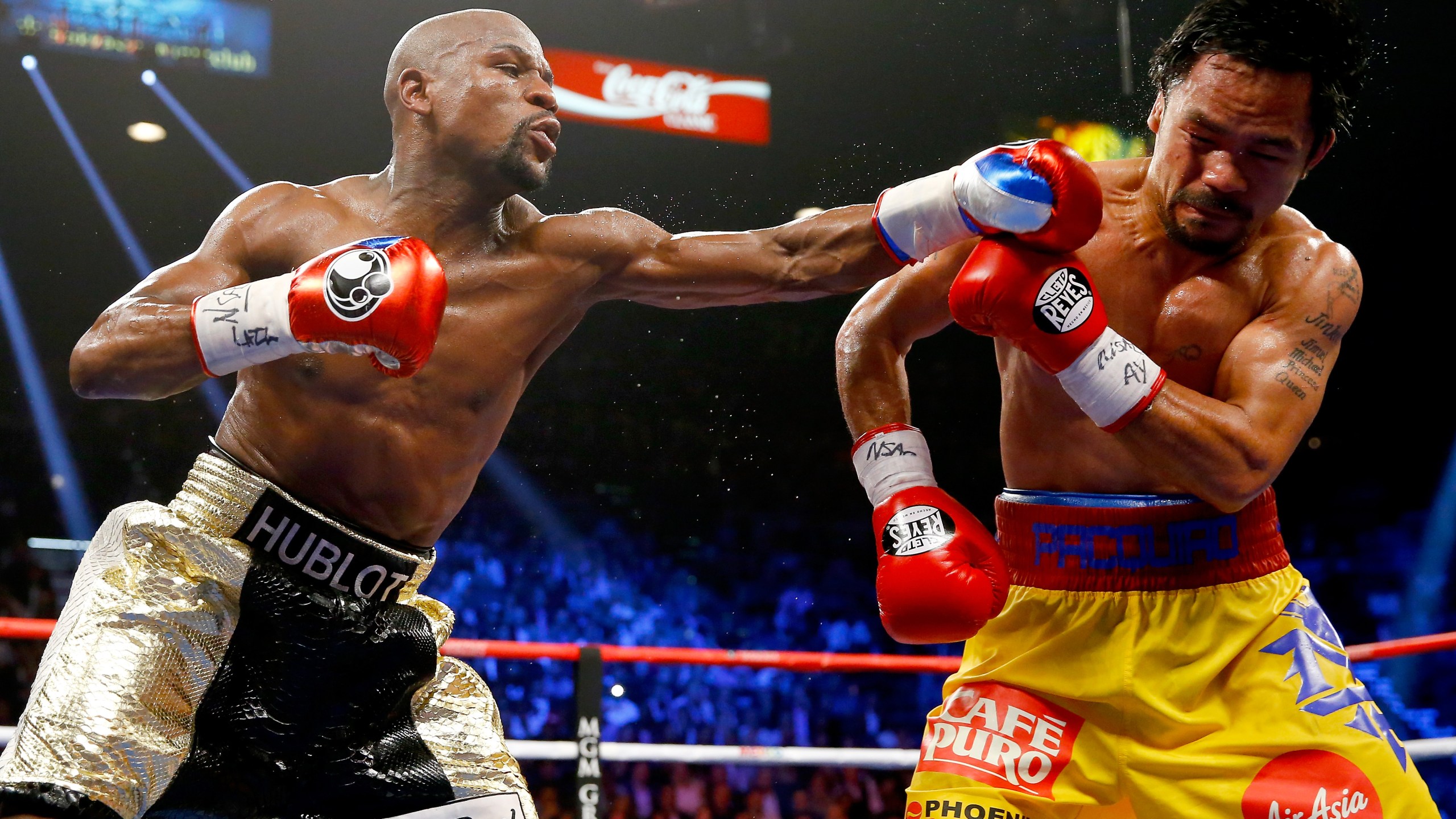 Floyd Mayweather Jr. throws a left at Manny Pacquiao during their welterweight unification championship bout on May 2, 2015 at MGM Grand Garden Arena in Las Vegas, Nevada. (Credit: Al Bello/Getty Images)