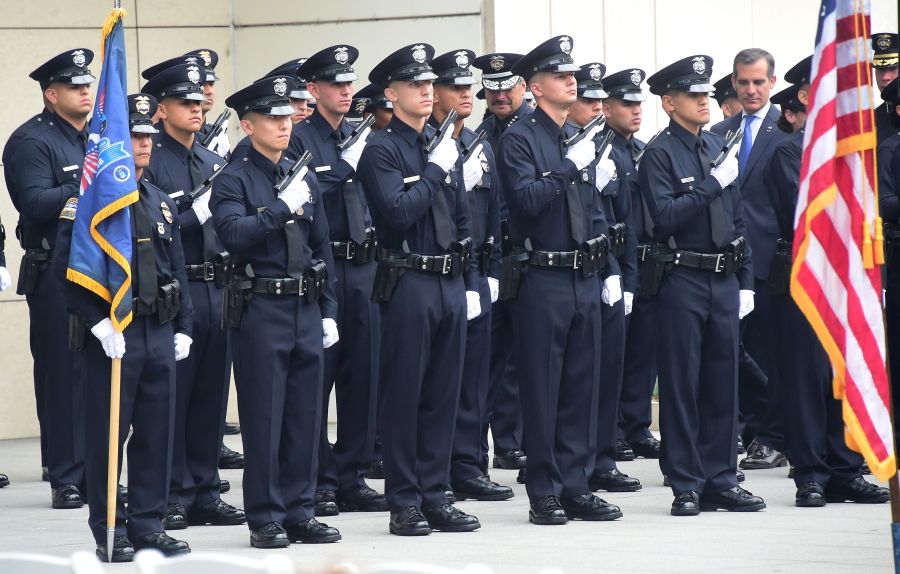 Los Angeles police chief Charlie Beck and mayor Eric Garcetti inspect new Police recruits on July 8, 2016, in Los Angeles. (Credit: Frederic J. Brown/AFP/Getty Images)