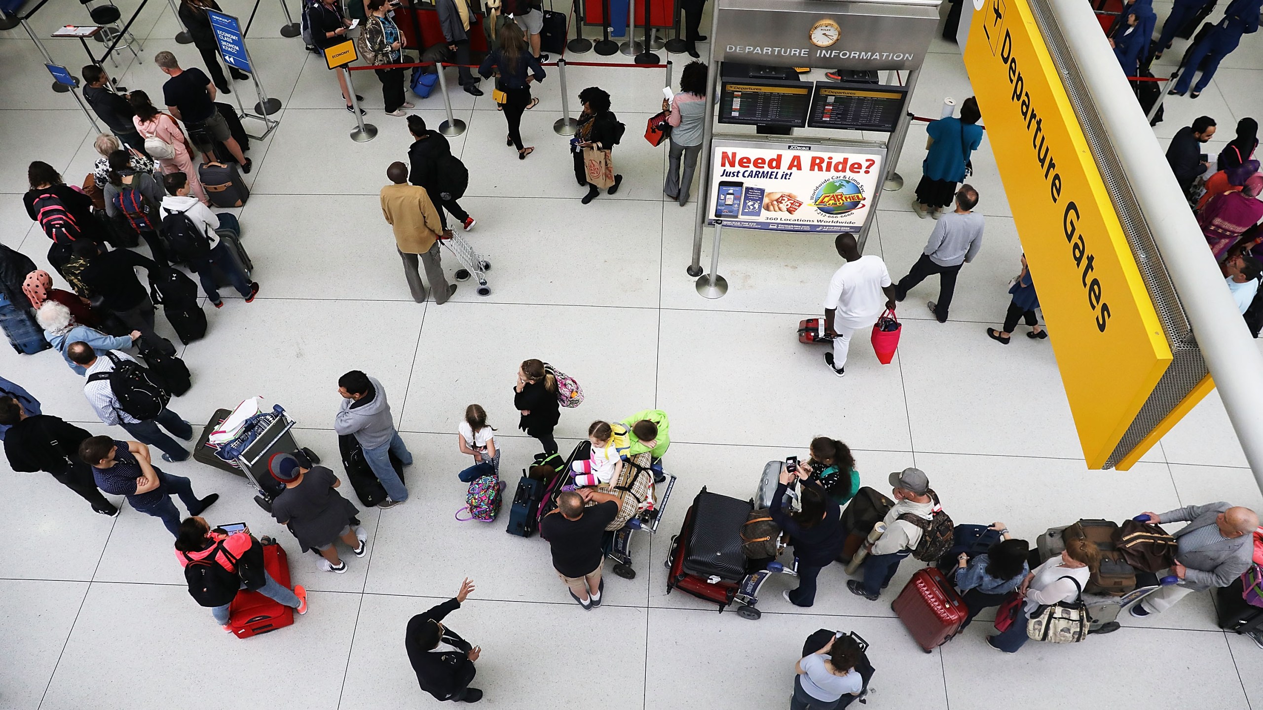 People wait in a security line at John F. Kennedy International Airport (JFK) on June 5, 2017 in New York City. (Credit: by Spencer Platt/Getty Images)