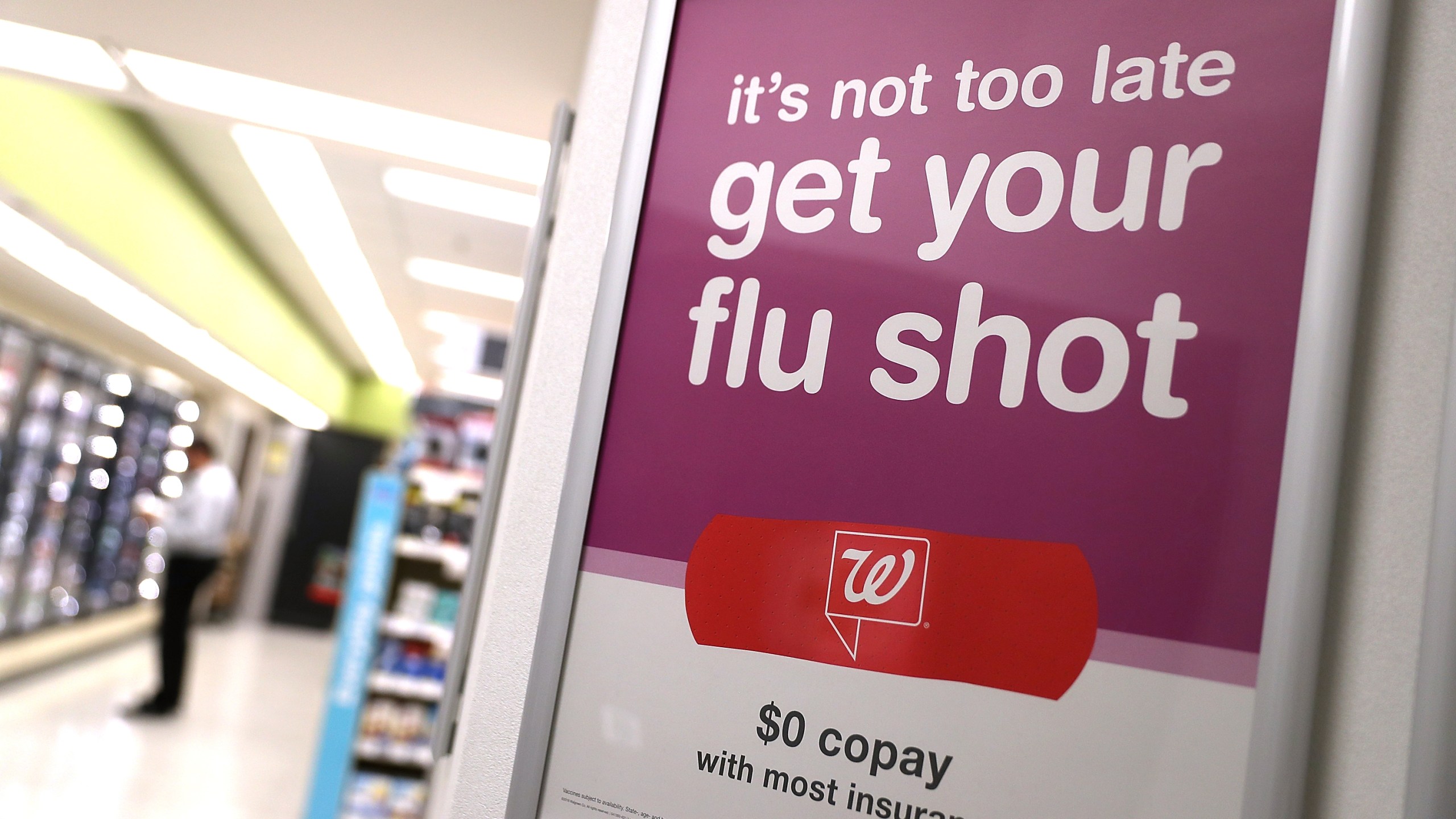 A sign advertising flu shots is displayed at a Walgreens phramacy on January 22, 2018 in San Francisco. (Credit: Justin Sullivan/Getty Images)